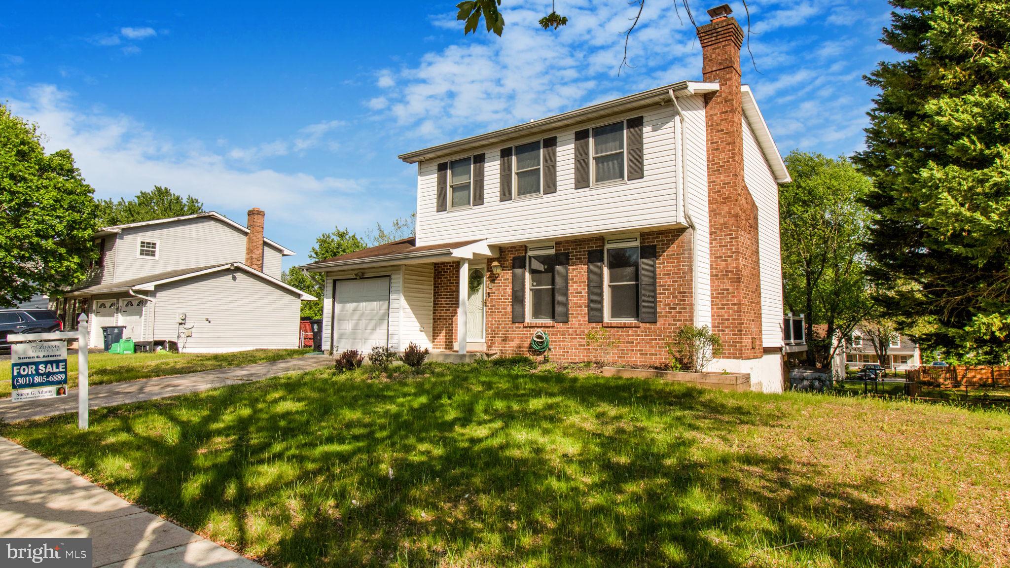 This charming 3-bedroom, 2 1/2-bath home is ready to move in with fresh paint, a professional cleaning, and a brand-new garage door. It features beautiful hardwood floors, a roomy eat-in kitchen, a separate dining room with French doors, an adjoining living room with a brick fireplace, a finished basement recreation room with a full bathroom, and a gorgeous recently installed deck in a fully fenced backyard for lazy weekends and memorable entertaining. Your family will immediately feel right at home. This home is a must-see.