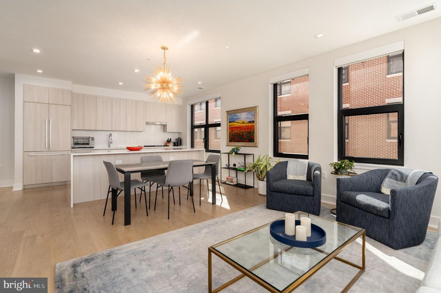 Coming Soon at The Dylan at Potomac Yard — an exceptional and rarely available corner residence offering refined contemporary living with sweeping views of the Capitol and the Potomac River.

This nearly new, meticulously maintained home features 2 bedrooms plus a den, 2.5 baths, and 1,605 square feet of thoughtfully designed living space. The open, light-filled floor plan showcases top-of-the-line finishes and over $70,000 in curated upgrades, creating a move-in-ready opportunity for the most discerning buyer. Expansive windows frame iconic vistas, while the seamless flow between living, dining, and kitchen spaces makes both everyday living and entertaining effortless.

Two standard side-by-side parking spaces and a private storage unit conveniently located adjacent to the parking convey with the residence—an uncommon and valuable offering.

Proudly offered by the original owners, this home reflects exceptional care and attention to detail throughout.

Launching Friday, 3/6, with open houses scheduled for 3/7 and 3/8.

Opportunities for this coveted corner layout are limited. The most recent identical residence secured a contract within two days—an indicator of both demand and distinction.