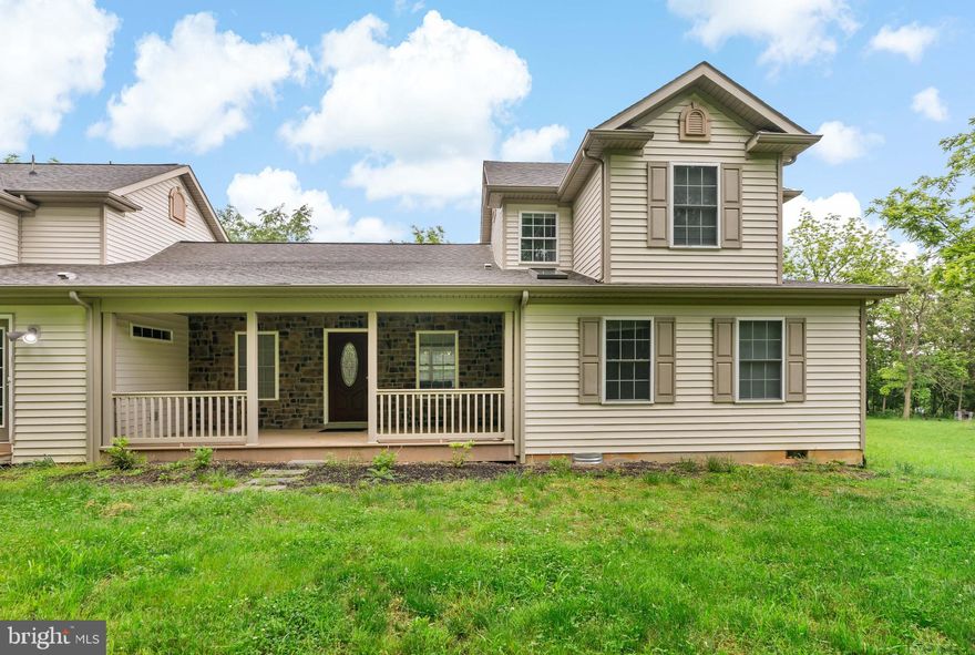 Check out this custom-built home on 1.84 private acres in Bunker Hill. This home was completely remodeled in 2021 and features many upgrades including new flooring throughout, quartz countertops, updated cabinets, newer appliances, a beautiful electric fireplace, and a deck off the main level. The primary bedroom, located on the first floor, features a walk-in closet and an oversized spa-like bathroom with a shower, soaking tub, and two separate sinks. Upstairs, you'll find 2 bedrooms, each with their own private, full bath. Additionally, there is an attached apartment or in-law suite that has a separate entrance and features a bedroom with its own living room, kitchen, full bath, and laundry hook-up. The long driveway and attached 2-car garage provide ample parking space, while the large yard is mostly level and surrounded by trees for privacy. Just off Route 11 and close to I-81, this home offers close proximity to Winchester, VA and other commuter routes.