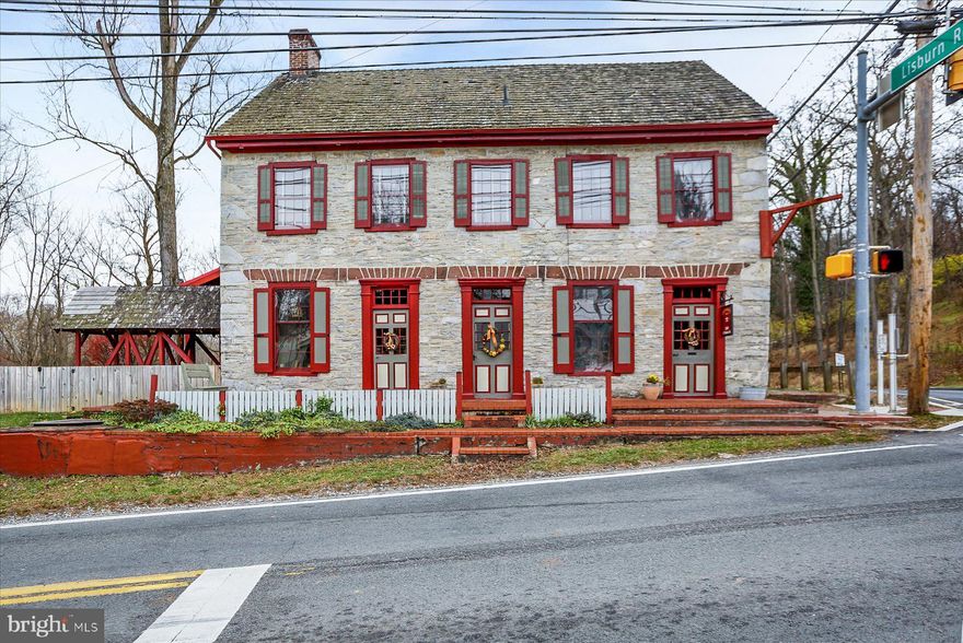 This charming Colonial home, built in 1790,  and separate Bungalow seamlessly blends historic character with modern comforts. This unique property offers  2 separate living  residences, which could be perfect for multi-generational living or blended families needing that extra living space.  Nestled on a generous 0.7-acre corner lot, the property boasts a serene view of lush trees and a gentle creek, creating a peaceful retreat just outside your door. Step inside to discover a warm and inviting interior featuring four spacious bedrooms and four and a half bathrooms. The heart of the home is the country-style kitchen, complete with extensive storage, stainless steel appliances, and space to create the finest meals or snacks. The primary suite offers a luxurious escape with a jetted tub and walk-in shower, while additional features like built-ins, chair railings, and hardwood floors enhance the home's charm. A second kitchenette and a full basement provide ample space for creativity and storage. Outside, the property features a detached garage with additional storage, a circular driveway for easy access, and a lovely porch to enjoy the tranquil surroundings. The Bungalow adds versatility, perfect for parents, guests, a separate living space using as a family compound-so many possibilities! Located in a peaceful area, this home is a perfect blend of comfort and functionality, making it an ideal choice for those seeking a serene lifestyle with easy access to modern amenities. Experience the warmth and charm of this unique property—your dream homes await!