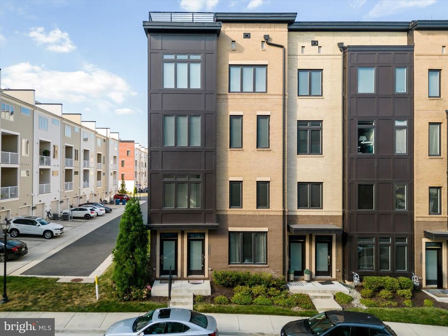 Welcome to your dream home in the highly sought-after Carlisle at Loudoun Valley! This exquisite lower-level, end-unit condo by Toll Brothers offers 3 bedrooms, 2.5 bathrooms, and nearly 1,700 square feet of contemporary elegance and luxury.

Upon entering, you are greeted by a light-filled, open floorplan with gleaming wood floors extending throughout the main level. The inviting foyer leads you into a spacious living room adorned with recessed lighting and sophisticated custom details. The elegant dining room, highlighted by modern recessed lighting, flows seamlessly into the gourmet kitchen. This chef’s paradise boasts top-of-the-line stainless steel appliances, quartz countertops, a 5-burner gas cooktop, a custom tile backsplash, a stainless range hood, a wall oven, a built-in microwave with convection capabilities, ample white cabinetry, and a pantry. A chic half bath with a pedestal sink and access to the rear-load 1-car garage with additional storage space complete the main level.

Ascend to the upper level to find the serene primary bedroom, featuring plush carpeting, a tray ceiling with crown molding, recessed lighting, a rough-in for a ceiling fan, an expansive walk-in closet, and a sliding door leading to a private covered deck—perfect for enjoying your morning coffee. The luxurious primary bathroom includes stylish tile floors, a dual-sink vanity with quartz countertops, a spacious shower with a seat and transom window and a linen closet.

This level also houses a conveniently located laundry area, a second bedroom with plush carpeting and rough-in for a ceiling fan or light, and a third bedroom with plush carpeting, rough-in for a ceiling fan or light, and large windows that flood the space with natural light. The second full bathroom is equipped with tile floors, a single-sink vanity, and a tub/shower combo.

The community amenities are exceptional, featuring 3 resort-style clubhouses, fitness centers, playgrounds, basketball courts, tennis courts, 3 pools, and abundant open green spaces. Perfectly situated for easy access to major commuter routes, shopping, dining, entertainment, the Ashburn Station Metro, and Dulles International Airport, this home combines luxury and convenience in an unparalleled location.

Seize the opportunity to make this exceptional residence yours. Contact us today to schedule a private tour!