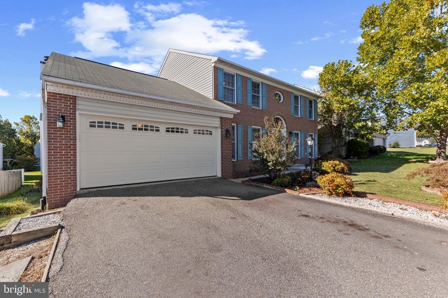 Plenty of room for everyone in this house! This large 5 bedroom Colonial with full basement with a large yard and fenced in backyard for the fur babies. Beautiful staircase showcases the large foyer with a separate office/study privately off to the side with the a formal living room/dinning room combined in opposite direction. However, most the living and gathering is around the kitchen granite island, kitchen nook and great room with fireplace. There is a large basement of 1748 sq ft which includes a bedroom, storage room and large den. Additional extras: many closets/storage places, roughed in basement bathroom, and bi-level outside trek deck  which leads down to large cement patio across back of house for entertainment.  There is a downstairs laundry room off from two car garage and a large shelf pantry off kitchen. The home has been partially renovated with new carpet throughout, some new vinyl floor and some tile flooring in basement. Professionally painted throughout home to include ceilings and closets.  You can't beat its convenient location near elementary/middle schools, shopping, YMCA, VRE stations and 15 minutes to interstate 95. And the best news, this home is empty and ready to move in now.