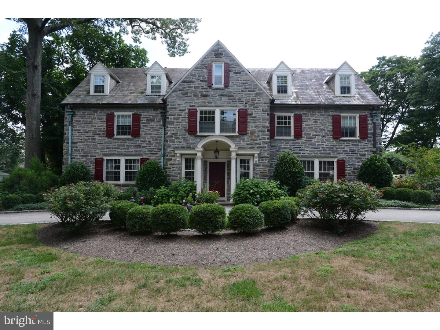 A classic colonial, completely redone, with 1920's grandeur and scale, made of all hand cut Pennsylvania field stone with stately slate roof. Detached two car garage with carriage house apartment (unfinished). Enchanting property with stone-walled lawns, grand patio and gardens. Large, flat lot with mature trees, professionally landscaped and lighted. Gracious and private, trellised patios with outdoor grilling area, bar and fireplace. Large double lot is well-located within one of the best and most cherished family neighborhoods on the Main Line. Quiet leafy streets with sidewalks, beautiful houses, and a preservation meadow. Walking distance to SEPTA (3 mins) and Suburban Square (10 mins' walk). The best that Wynnewood, Narberth and Ardmore have to offer for markets, shopping, brewpubs, restaurants and convenience. First class interiors, beautiful rich paneling, high ceilings, large, clubby reception rooms, with grand, formal living and dining rooms; First-class chef's kitchen with 8 person sit-in bar, spacious island w 3rd sink, butler's bar w 4th sink; Great back mud room w 4 lockers and benches; Seven bedrooms, Master bedroom suite with new bathroom, w/i closets, private WC, sunporch and fireplace. Full third floor, full lower level with wine cellar and tasting room/bar.