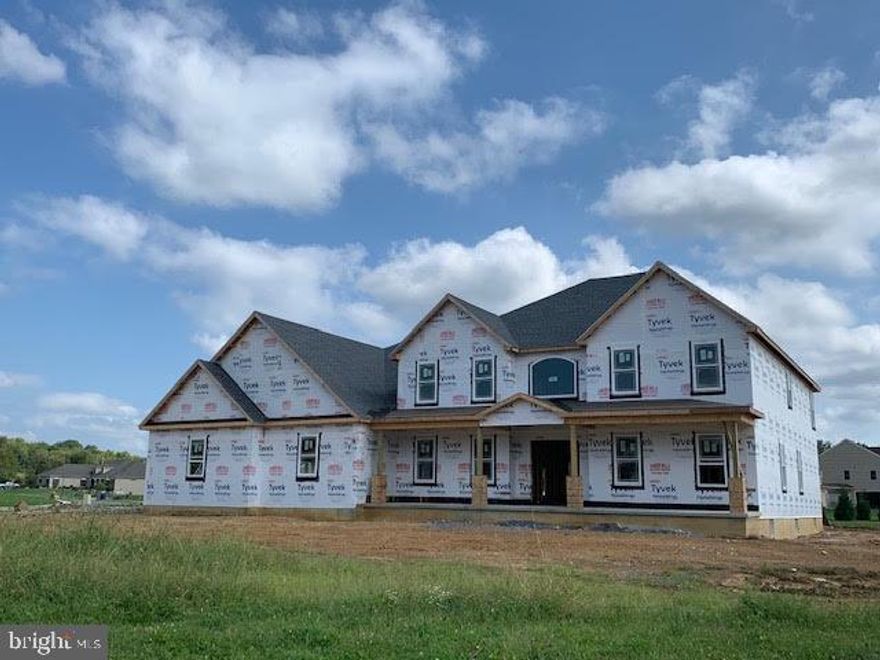 Whether you enjoy entertaining indoors or outside, this home was designed with intentions to impress.  From the striking double door foyer entrance featuring a curved staircase, to the coffered ceilings in the 2 story family room, you will love entertaining your family and friends as you gather around the 12 ft kitchen island.  When you take your party outdoors, you will enjoy the 26x28 covered patio with outdoor fireplace, perfect for the fall weather evenings.  This home features 2 bedrooms on the main level- each with private baths, and 3 bedrooms/2 full baths upstairs.  Buyer still has time to make interior color selections!