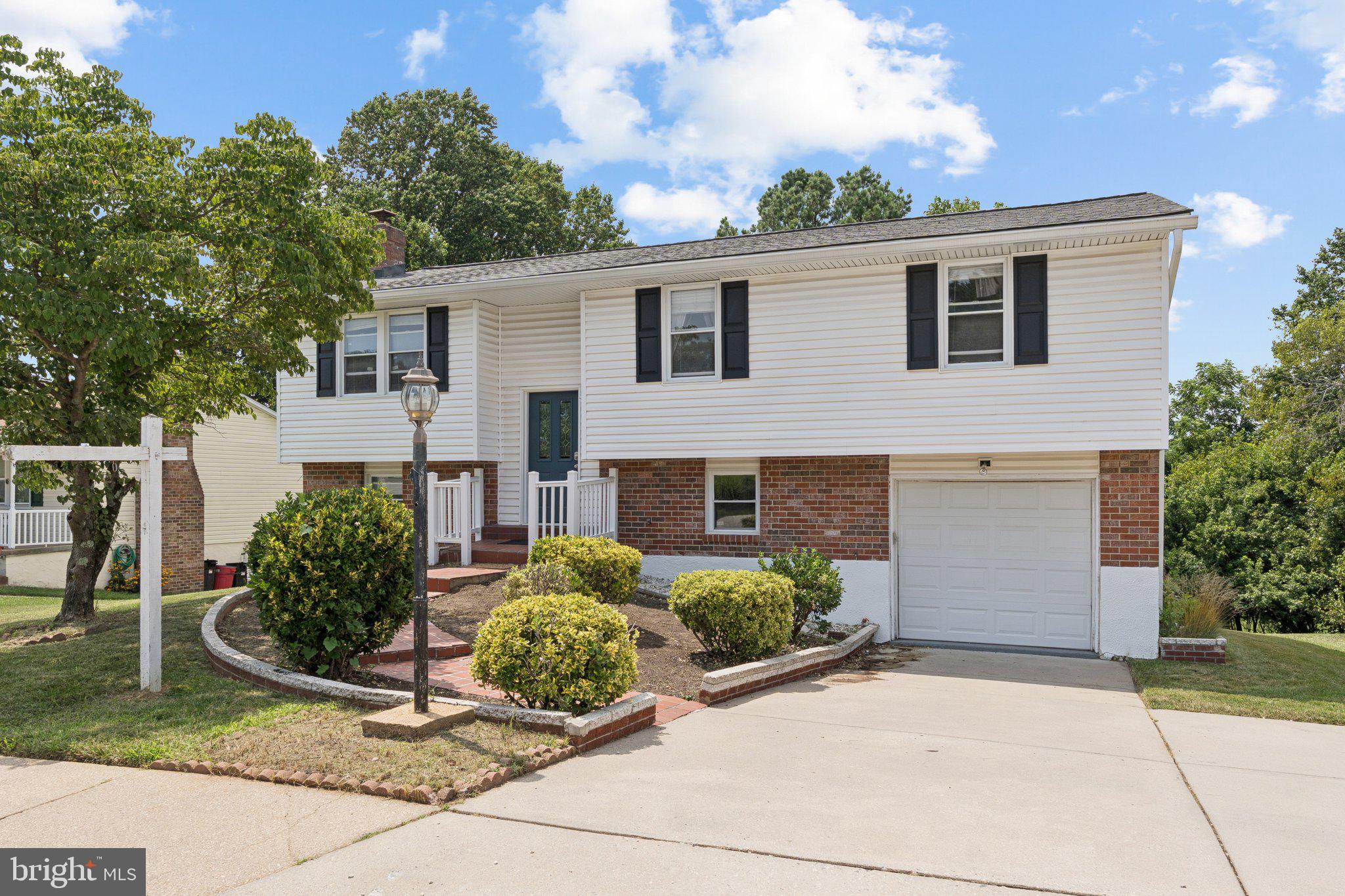 Charming 3BR, 3BA split foyer with recently replaced roof and 1-car garage. Features include a bright main level, private primary suite, and a fully finished lower level with second kitchen—perfect for in-laws, guests, or rental potential. With multiple patios and a large rear yard backing to open space. Versatile layout in a quiet, established neighborhood.