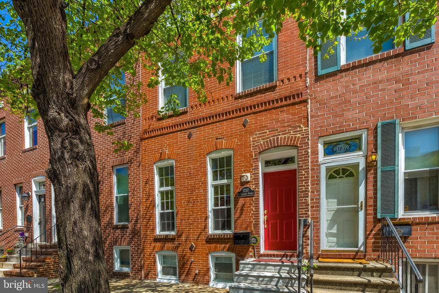 Stunning 3 bedroom, 2.5 bathroom home with 2-CAR PARKING PAD, finished basement (could be 3rd bedroom, home office or additional living room) and multiple decks in Federal Hill.  1st floor has a huge open living & dining room with exposed brick, recessed lighting and wood floors and leads to the kitchen and walks out to the rear parking pads.  The kitchen has stainless appliances, exposed brick, tile floors, granite counters, recessed lighting and tons of natural light from the side windows. The 2nd floor has 2 bedrooms, 2 full bathrooms and an open office/den area.  The primary bedroom has a massive shower! The rear bedroom has a private deck and leads to the rooftop deck.  The finished basement has plenty of room to spread out and could be a 3rd bedroom, home office or additional living room. The basement also has storage space and the laundry room. You'll love the location, close to all the Federal Hill area attractions and easy access to I-95.