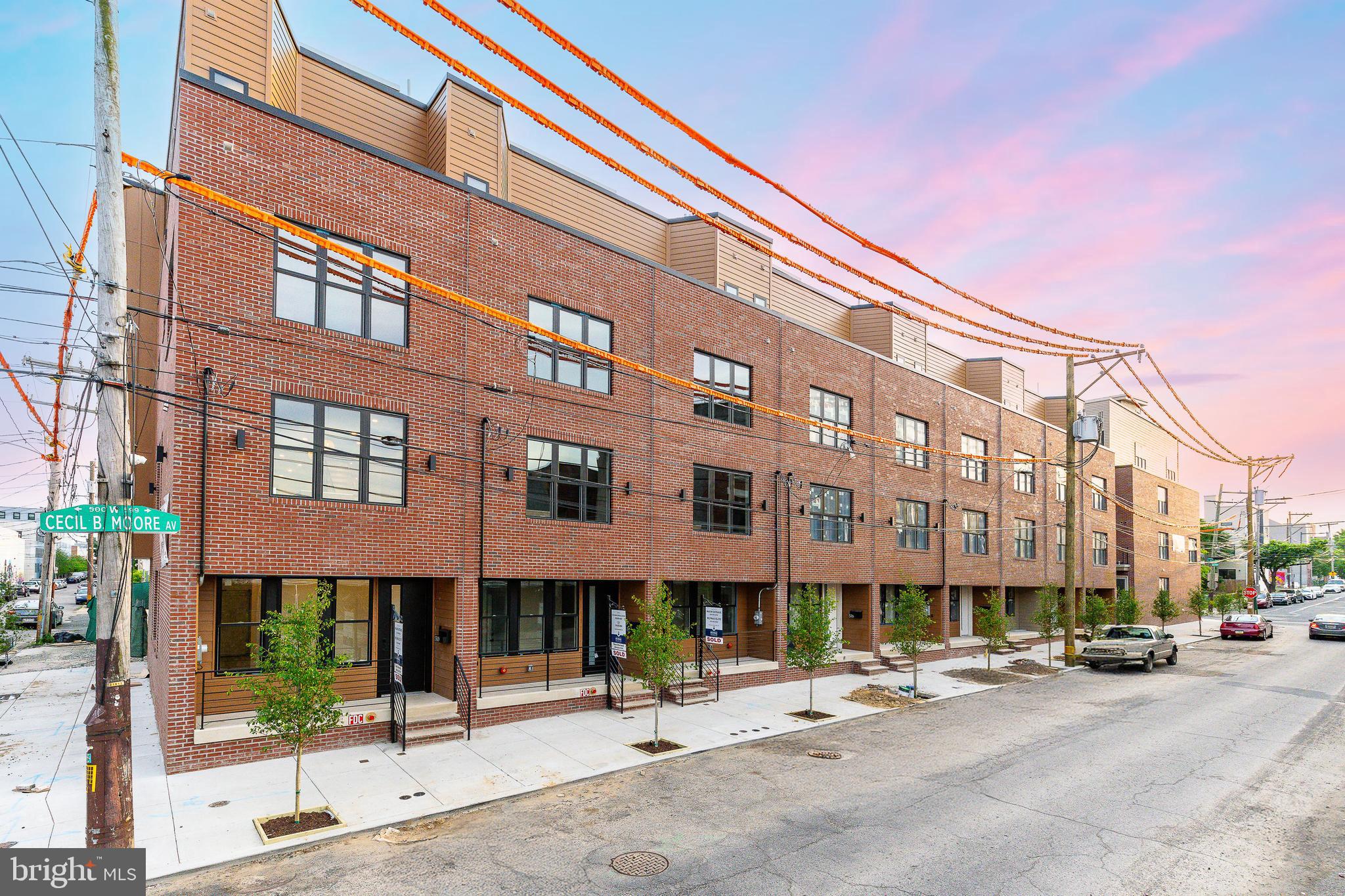 Randolph Courts introduces a new level of sophistication in design, blending industrial aesthetics with vibrant earth tones and lush greenery to create a unique "urban elegance." This exclusive community will feature 18 single-family homes, each offering 3 bedrooms, 3.5 bathrooms, and four outdoor spaces, including a private green roof. These remarkable residences span over 3,000 square feet, include 2-car garages, high ceilings, and showcase an exceptional level of designer finishes.
The first floor provides direct access to the garage, along with a powder room for added functionality and convenience. Moving to the main level, the open floor plan showcases a high-end kitchen equipped with custom cabinetry and sleek quartz countertops, perfect for cooking and entertaining. This space flows effortlessly into the living and dining areas, with large windows and a private balcony, blending indoor and outdoor living seamlessly.
The second floor offers two spacious bedrooms—one with an en-suite bathroom and another with access to a hallway bathroom. The third-floor primary suite is a private sanctuary featuring a walk-in closet and a luxurious bathroom with a double vanity, soaking tub, and walk-in shower.