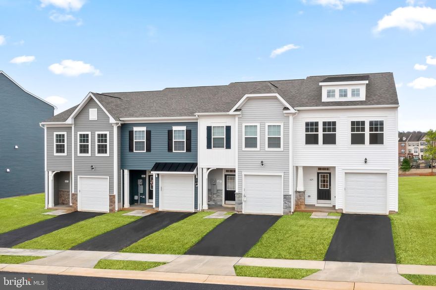***OFFERING UP TO $6,500  TOWARDS CLOSING ASSISTANCE FOR PRIMARY RESIDENCE WITH THE USE OF PREFERRED LENDER AND TITLE*** SUMMER DELIVERY! Brand new construction of the Lynnhaven II in Berkeley County’s premier planned community featuring a clubhouse, swimming pools, walking trails, lush landscaping and mountain views. The Lynnhaven II is a 2 level townhome featuring a covered porch, 1 car garage and 3 Bedrooms with 2.5 Bathrooms. The front door leads directly into the open concept main level including 9 ft. ceilings, foyer with tray ceiling and coat closet, access to the garage, powder room and continuing into the spacious kitchen featuring stainless appliances, an optional island, painted cabinets and quartz countertops. The spacious family room has walkout access to the rear yard with a 15-lite glass door that leads to a 16'x8' patio. The primary bedroom features a large walk-in closet and sitting area. The primary bathroom features dual vanities with tiled shower with seat, private water and linen closets. This level includes 2 additional bedrooms, hall bath with shower/tub combo, linen closet and upstairs laundry. *Photos may not be of actual home. Photos may be of similar home/floorplan if home is under construction or if this is a base price listing. Some photos have been virtually staged.