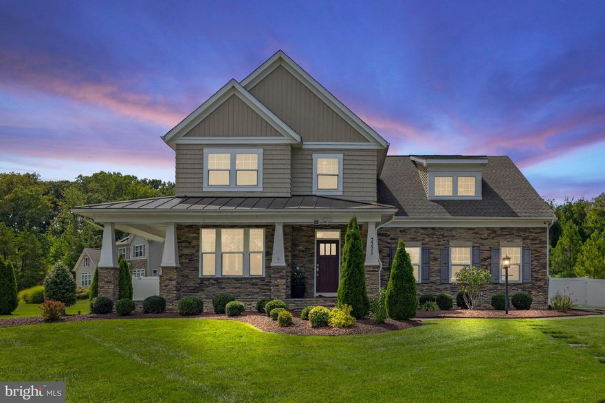 Welcome to this exquisite Craftsman-style home situated on over an acre in Lorton, Virginia. 

Upon entering, you will appreciate the attention to detail throughout the main level. The chef’s kitchen is equipped with GE Café Series stainless steel appliances, including a 6-burner gas cooktop, double oven, and a separate microwave. The upgraded 42" kitchen cabinets with crown molding, dove-tailed drawers, and soft-close features enhance the functionality of this space. The oversized island provides ample seating and workspace, complemented by upgraded granite countertops and a stylish ceramic tile backsplash. 

The main level also features a bedroom adjacent to a full bathroom, perfect for guests or multi-generational living. The luxurious walk-in shower and elegant fixtures in the main level bath offer a spa-like experience. Enjoy the warmth of the two-way gas fireplace that connects the dining room and family room, creating a cozy atmosphere. The wide plank hardwood floors and oak staircases add a touch of sophistication.

The upper level is dedicated to relaxation and privacy. The owner’s suite includes dual walk-in closets and a sitting room, while the spa-like ensuite boasts a luxurious soaker tub, dual porcelain sinks, and an oversized shower with a glass door enclosure. Additional upstairs bedrooms include a princess suite with a full bath, along with two generously sized bedrooms sharing a well-appointed hall bath. The laundry room features upgraded cabinetry for added convenience.

The finished lower level offers versatile living space, including a recreation room, media room/den, and a sixth bedroom with a legal egress and walk-in closet. A full bathroom on this level provides added convenience, and the walk-up basement features an extra-wide passageway.

The exterior of the home is equally impressive, featuring a wrap-around front porch and low-maintenance HardiePlank siding with brick and stone accents. The roof is equipped with 30-Year architectural shingles, and the property is enhanced by a 6' privacy fence, custom patio, and an in-ground sprinkler system. Advanced security features include a vintage security alarm and surveillance system.

Schedule a viewing today to experience the exceptional lifestyle this property offers!