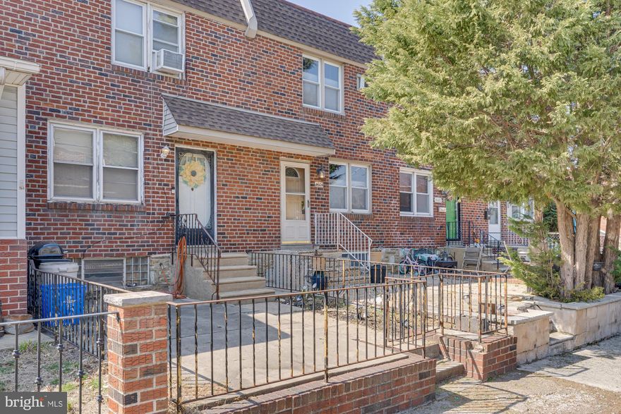 Don't miss your chance to own a charming row home in the desirable Northeast neighborhood of Holmesburg. This move-in-ready home has been thoughtfully updated, featuring freshly painted bedrooms, an updated electrical panel, a new washer and dryer, and a new roof installed in 2020—offering peace of mind for years to come. A mature tree and a classic brick exterior create a warm welcome as you approach the covered front entry. Inside, the spacious living room is bathed in natural light from two large windows, complemented by new plush carpeting that adds comfort and coziness. The dining and living area seamlessly connects enhancing the flow of this inviting space. The dining room boasts hardwood flooring, crown molding, a chair rail, and charming faux wood ceiling beams, adding character and depth. The adjacent galley kitchen is designed for both style and efficiency, featuring ample hardwood cabinetry, matching crown molding, a ceiling fan for added comfort, durable vinyl flooring, and a breakfast bar—perfect for quick meals or morning coffee. Upstairs, you’ll find three bedrooms, each with wall-to-wall carpeting and ceiling fans for year-round comfort. The spacious primary bedroom includes new carpeting, two closets and a built-in shelving nook, ideal for storage or display. A shared hall remodeled bath serves the upper level, complete with floor-to-ceiling tile, a tub-shower combo, and a dedicated linen closet for added convenience. Downstairs through the kitchen, the fully finished basement offers incredible flexibility. This versatile space includes a rare beautiful full bathroom with a walk-in tiled shower in the laundry room, making the finished basement ideal for use as a fourth bedroom, guest suite, or additional family room. The dedicated laundry area keeps things organized, while an exterior door provides direct access to your private driveway with off-street parking for your car. Enjoy all the conveniences of Holmesburg living with easy access to I-95 and downtown Philadelphia making commuting a breeze. Schedule your showing today and make this charming home yours!