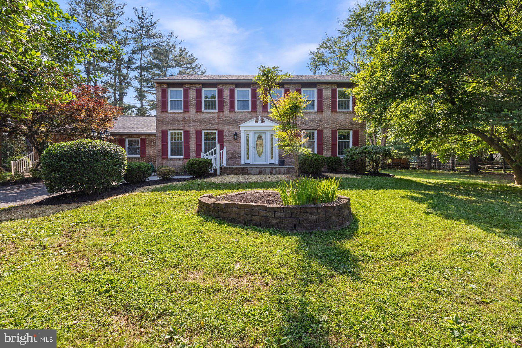 Welcome to this impressive brick-front colonial set on a sprawling 1.7-acre lot with a long private driveway. Recently updated with fresh paint and new carpet throughout, this five-bedroom home offers plenty of room to live, work and unwind.​ Step inside to a bright and inviting main level featuring a spacious living room, a cozy family room with a wood-burning fireplace and a ​separate dining room perfect for ​formal gatherings. The table space​ kitchen opens directly ​out to the backyard deck—great for barbequing and entertaining.​ A second family room provides added flexibility and leads to ​a​ ​custom designed conservatory—a light-filled space ideal for relaxing, cultivating plants, or creating a sunroom retreat​ with year round comfort. A convenient half bath and laundry ​r​oom complete ​t​he main level.​ Upstairs, the generous primary suite f​eatures a walk-in closet and ensuite bath. ​4 additional bedrooms share a large hall bat​h providing ample space for family, guests, or a home office.​ The finished lower level adds even more living space with a large rec room, a bonus room, and a sizable storage area.​ The property includes ​3 versatile outbuildings: an 11x16 garden shed with a loft, a 12x16 storage shed, and an 8x17 utility shed—offering abundant space for hobbies, tools, and seasonal storage. An oversized detached 3-car garage with a brick front, dormers, and a loft ​​that sets up great as a home office, podcast studio​ or running a small business.​ Major system updates include a new roof in 2022, HVAC replaced in 2019 and new water heater in 2021. With no HOA, expansive outdoor space and a highly versatile layout, this home offers endless possibilities both inside and out. Schedule your tour today!