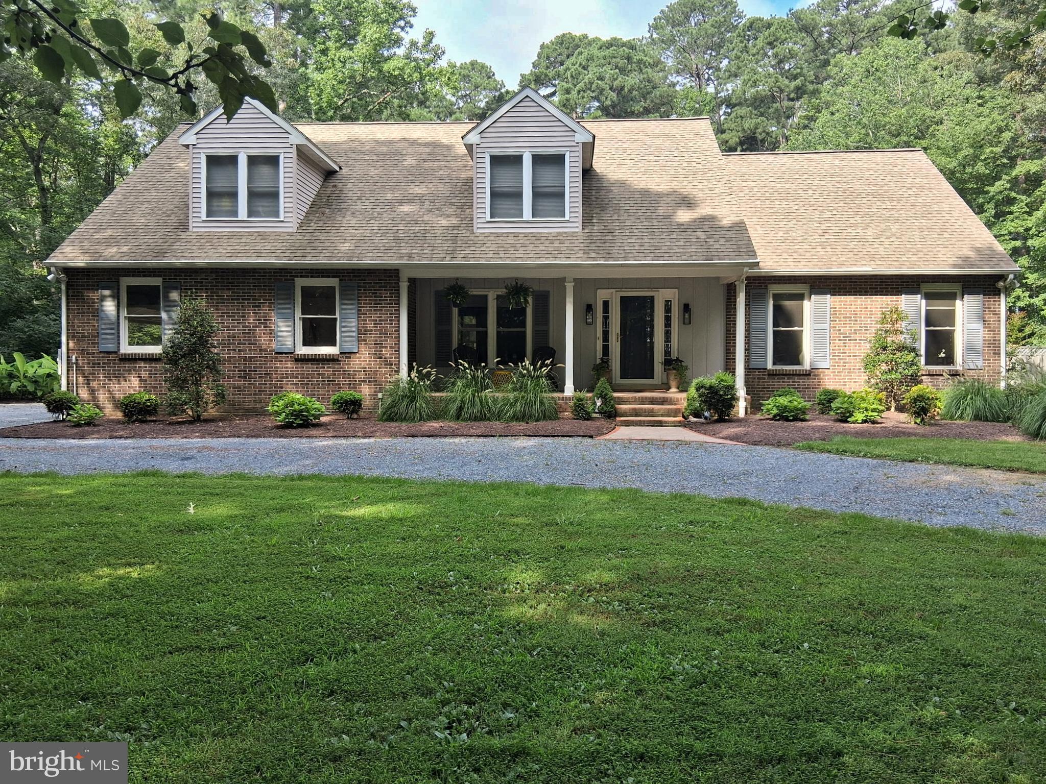 Welcome to 6889 Travelers Rest Circle in Easton, Maryland—an exceptional opportunity to own a thoughtfully updated Cape Cod home in the highly sought-after Travelers Rest neighborhood. Privately situated on 5.64 acres of professionally landscaped grounds, this residence combines timeless architectural charm with modern amenities for an elevated Eastern Shore lifestyle.
Offering over 3,300 square feet of finished living space, the home features four spacious bedrooms and two and a half bathrooms, including a main-level primary suite that has been recently enhanced with hardwood flooring and a fully renovated en suite bath. The layout is both traditional and functional, with formal living and dining rooms, a large family room with built-in shelving and a gas fireplace, and a three-season room perfect for enjoying year-round views of the tranquil setting.
The heart of the home is the chef’s kitchen, appointed with granite countertops, a center island, tile flooring, and newer stainless steel appliances including a gas range and wine cooler. This space opens into a bright and inviting breakfast area, making it ideal for both daily living and entertaining.
Upstairs, you'll find three generously sized guest bedrooms, a full bathroom, a home office, and an expansive storage room. Recent updates include new carpeting in the guest bedrooms and fresh interior paint throughout, making this home move-in ready.
Step outside to your private outdoor oasis. The backyard is anchored by an in-ground pool with a cascading hot tub, complemented by a flagstone patio—an ideal space for entertaining, relaxing, or enjoying nature. An invisible fence surrounds much of the property, and the circular driveway leads to an attached two-car garage, offering both convenience and curb appeal.
Enjoy seasonal views of the Tred Avon River from the front porch and peaceful surroundings in one of Easton’s most desirable areas. Located just minutes from the historic towns of Easton and St. Michaels, this home offers a perfect balance of privacy and proximity to waterfront activities, dining, shopping, and cultural attractions.
Additional highlights include a **newly installed private septic system**, central air conditioning, a new washer and dryer, and fiber optic internet (Easton Velocity). The property is served by well water and features a crawl space foundation.
Whether you’re seeking a full-time residence or a tranquil second home on Maryland’s Eastern Shore, 6889 Travelers Rest Circle offers a rare combination of space, updates, privacy, and location.