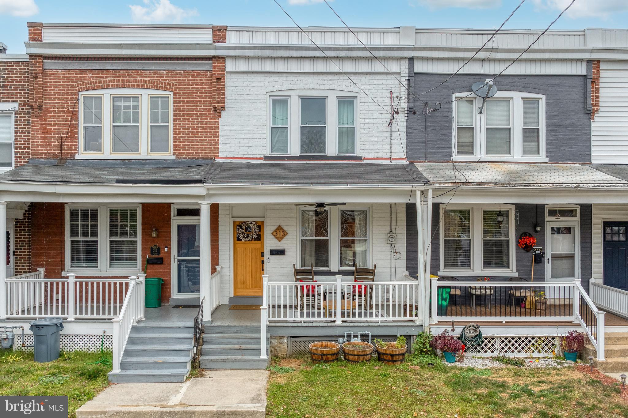 Welcome to your charming and cozy city home! This delightful property is the perfect place to call home, offering comfort, convenience, and style. As you step inside, you will be greeted by a warm and inviting living space, showcasing a beautiful accent wall & exposed brick. The living room features new windows that let in plenty of natural light, creating a bright and cheerful atmosphere. The dining room is very spacious and has a built in bar, perfect for entertaining & providing extra storage. There is a convenient half bath on the main level. The kitchen is efficiently designed, providing everything you need to prepare delicious meals for yourself and your loved ones. With modern appliances and plenty of cabinet and counter space, you'll be able to whip up culinary creations with ease. Upstairs, you'll find three cozy, yet spacious bedrooms, each with gorgeous hardwoods and the primary bedroom has a shiplap accent wall. Outside, you'll find a small but gated yard, great for pets! And a relaxing covered front porch-perfect for morning coffee and enjoyable summer evenings. Schedule your showing today!