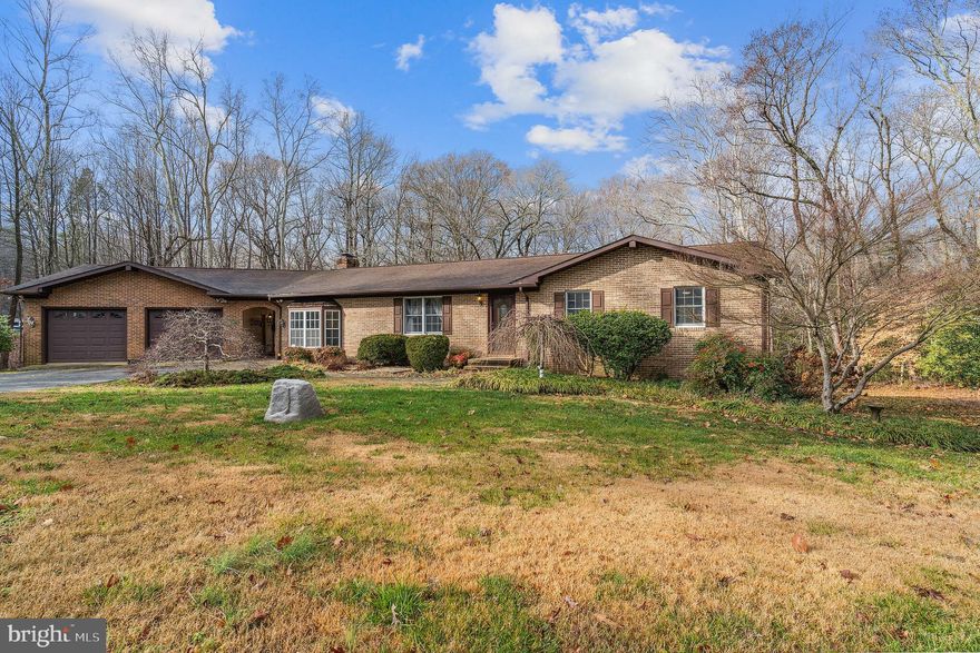 Brick rambler set on semi private lot, quiet cul de sac.   Oversized two car garage with a spacious breezeway connecting it to the house.  Inside you will find a family room open to dining area and kitchen with ss appliances and granite counter tops, and laundry room off the kitchen.   Owners suite has built in storage, private bath.    Unique floor plan on the opposite side of the home with an additional bedroom and bath.   Lower level awaits your design and has a walk out door leading to the wooded backyard.  Main level has door leading to rear deck, perfect for entertaining.  Don’t miss the bonus storage space under the garage.  Quiet country setting but just minutes away from the shopping, restaurants and all that St Mary's County has to offer.   New well pump installed recently.
