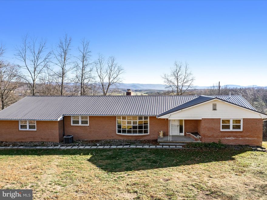 Breathtaking views! Nestled in a sweet spot overlooking farms and mountains you'll find this Spacious ranch style home with fully finished basement on a lovely, 3-acre lot. Create your own farmette and live on the land! Huge covered back porch and plenty of room inside and out, this home just needs your finishing touches. Affordably priced at only 349,900 while offering over 4300sqft of finished living space. This home offers large rooms, beautiful hardwood floors, and a great floorplan. Come take a tour today!