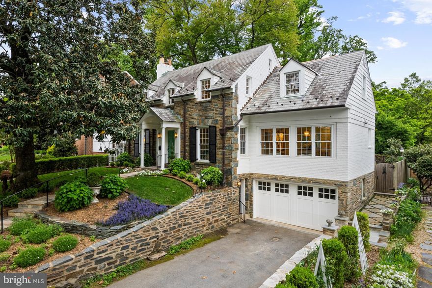 From the moment of arrival, this extraordinary Belle Haven residence makes an unforgettable impression, embodying timeless sophistication, impeccable craftsmanship, and the effortless allure of country club living. Filled with exceptional natural light at every turn, the home feels both vibrant and inviting. Meticulously renovated to the highest standards, the home artfully balances historic character with luxury designer finishes, creating a property of remarkable beauty and distinction. Offering over 3,000 square feet of refined living space with 3 bedrooms and 4 full baths, inside every detail has been curated. Quarter-sawn oak hardwood floors, original 1930s hardware with glass knobs and brass backplates, custom millwork, thoughtfully integrated storage throughout, and a sophisticated palette of Farrow & Ball paints and Pierre Frey wallpaper establish interiors of exceptional warmth and elegance. Designer lighting by Visual Comfort, Niermann Weeks, Hudson Valley, and select one-of-a-kind antique fixtures adds a collected, bespoke quality throughout. The gracious main level is designed for both entertaining and intimate daily living, with beautifully scaled formal and informal spaces that flow seamlessly from one room to the next. At the center of the home, a custom kitchen by Lobkovich Kitchen Designs serves as a true showpiece. Custom cabinetry, solid brass hardware, a Lacanche Savigny Classique range, Sub-Zero refrigeration, Fisher & Paykel dishwasher, an expansive island and integrated pantry storage create a culinary space as functional as it is stunning. The upper level is anchored by an elegant primary suite offering the tranquility of a boutique hotel retreat. Custom built-in chests of drawers, cedar-lined storage, and a private balcony create a serene escape, while the spa-inspired bath is richly appointed with Statuario marble, radiant heated floors, a Victoria + Albert soaking tub, and custom vanity. Secondary bedrooms are equally refined, each offering full bathrooms with classic black and white finishes. The fully reimagined walkout lower level continues the home’s elevated aesthetic with radiant heated floors, wide-plank Italian ceramic tile, a custom-built dry bar, built-in banquette seating, gas fireplace, stunning marble bathroom with radiant heated floors, and versatile living spaces ideal for guests, entertaining, or relaxed everyday enjoyment. Complementing this level is a rare, fully waterproofed, oversized garage offering exceptional versatility beyond traditional parking and storage, with the potential for conversion into a fourth bedroom or additional finished living area, providing valuable, flexible square footage not commonly found in Belle Haven. Outdoors, the property unfolds as a private garden sanctuary. Mature boxwoods, hydrangeas, magnolias, rose gardens, slate pathways, stone walkways, terraces and architectural arbors create an enchanting setting of rare privacy and beauty. A Campania fountain and jasmine trellis add to the sense of romance, while the screened-in porch, appointed with Ipe flooring and infrared heater, offers year-round outdoor living at its finest. Equally impressive are the home’s extensive infrastructure upgrades, including new AC and ductwork, Rockwool insulation, updated plumbing and electrical systems, drainage and waterproofing improvements, new doors, extensive exterior stone work, and numerous other enhancements that ensure effortless modern comfort. An extensive list of features and improvements is available upon request. Enjoy living across from Belle Haven Country Club, minutes to Old Town Alexandria, the Potomac River and Bike Trail, and 10 minutes to Reagan National Airport!