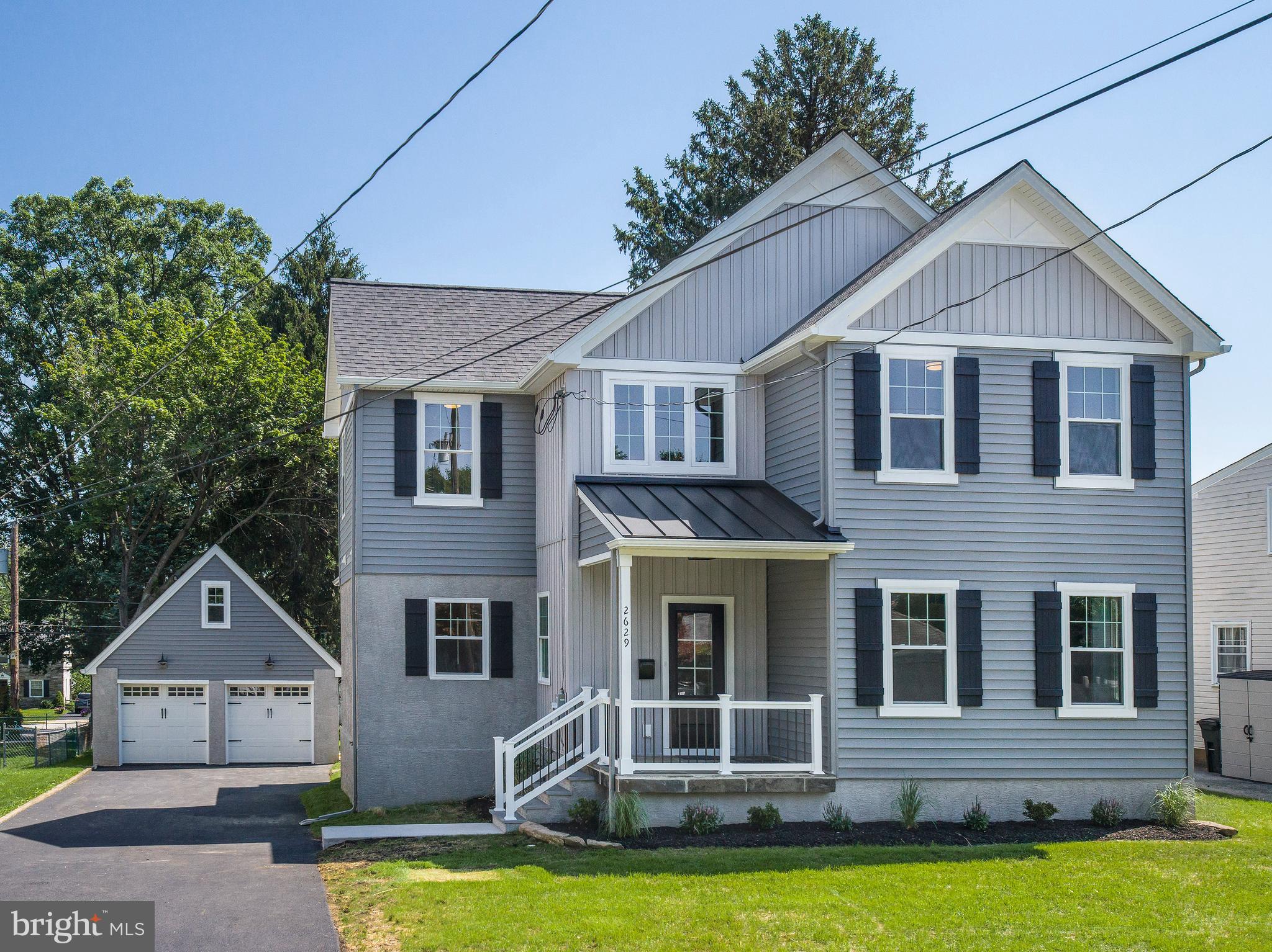 Welcome to this stunning reimagined colonial, expertly rebuilt by the highly regarded eBuild Construction. Taken down to the studs and thoughtfully redesigned, this home blends timeless architecture with sophisticated modern finishes—perfectly positioned on a quiet, tree-lined street in the heart of Broomall.A charming flagstone porch welcomes you inside, where you’ll find a classic center hall layout with 9-foot ceilings and engineered hardwood floors throughout the main level. The sun-filled living room features custom millwork and an electric fireplace, creating a warm, elegant atmosphere. The formal dining room is enhanced by crown molding, while the adjacent gourmet kitchen impresses with an oversized island, stainless steel appliances, gas range, and seamless flow into a secondary living space—ideal for entertaining.
Step outside to the expansive TimberTech deck, perfect for summer grilling, alfresco dining, and relaxing with friends. A separate mudroom, powder room, and laundry room complete the main floor, along with a second flagstone porch for even more outdoor enjoyment.Upstairs, the oversized primary suite is a luxurious retreat with a tray ceiling, large walk-in closet, and spa-like ensuite bath featuring dual shower heads and sleek tile finishes. The secondary "princess suite" also includes its own walk-in closet and private access to a full bath. Two additional generously sized bedrooms share a well-appointed hall bath. All bedrooms offer ample closet space, natural light, and a thoughtful flow—ideal for today’s living.The finished lower level expands the home’s versatility with exterior access via Bilco doors. Whether you need a second family room, a private home office, a playroom, or even a fifth bedroom, this space is ready to adapt to your lifestyle. Additional features include two-zone HVAC, a detached two-car garage with extra storage, and a spacious flat lot. Located just minutes from schools, parks, shopping, and with easy access to Route 476, this turnkey home offers the perfect blend of comfort, style, and convenience.