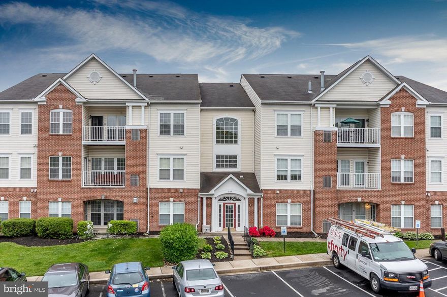 Charming 2nd floor unit with elevator access to a  2 bedroom and 2 bath unit with den that has access to balcony which overlooks community pond - open floor plan. gas fireplace, cac, new flooring, granted counter tops in kitchen, estimated square footage approximately 1,332