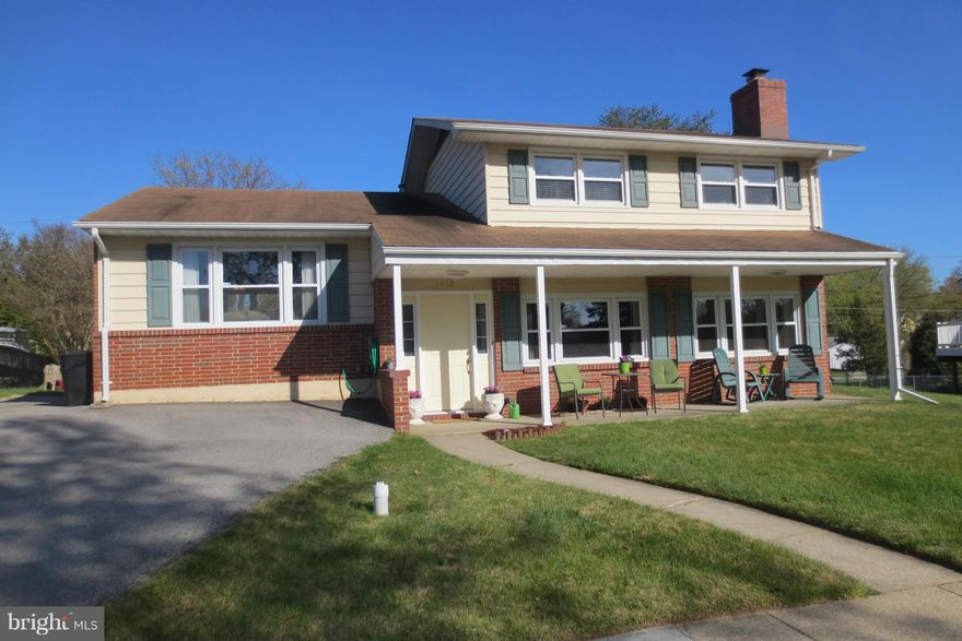 HOME WARRANTY! Gorgeous Home with Open Floor Plan and Three Finished Levels, 1900 finished Sq. Ft.! Renovated Granite Kitchen with Breakfast Bar & New Appliances opens to Dining Room. Updated Bathrooms. Beautiful REAL Hardwood Floors on main & upper levels. New HVAC unit! 4 Bedrooms,Huge Yard, Fireplace, Covered Back Patio & Front Porch. Lots of windows! Extended Double Driveway, Basement & more!