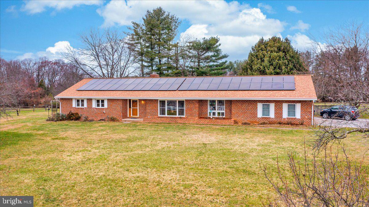 REDUCED! + Seller just added an extra 1/2 Bath in the Basement!! This unique 90 foot all brick rancher sits on 5.4 acres and is located in the heart of Finksburg with so much to offer any buyer. As you enter the home you will notice the large living room to the left, then 3 nice size bedrooms, 2 full bathrooms off to the right side. Continue through the cozy family room that includes a brick wood burning fireplace and a french door that leads to the 3-season room. Nice hardwood floors throughout. The kitchen was renovated just a couple years ago with quartz counter tops, all wood/soft close cabinets & drawers plus all new SS appliances. It includes an island and ceramic tile floor as well. Off of the kitchen is a large pantry, laundry area w/ a drop-down table for folding and a powder room. There is an interior access door to the garage, a staircase to the basement and an exterior door leading to an enclosed area that could be used as a mudroom. There is a separate dining room off the kitchen that connects around to the living room. The fully finished basement runs the length of the house, with a wood stove, utililty room and 2 extra bedrooms. The suspended ceiling is brand new, the floor has been sealing and all the walls painted. The 3 season room is located off the family room, includes skylights and a ceiling fan. It leads you to the enclosed, in-ground, heated pool. When the heater is turned on it helps to heat the 3 season room in the winter and was just replaced recently. This home sits on a flat lot, has a fenced area perfect for pets and fruit trees (3 pear, 3 apple and 1 peach). The Barn is maintainence free, 40x30 and has 8 stalls. Many upgrades to this impressive property with room to add your own touches. Don't miss it, set an appointment today!
