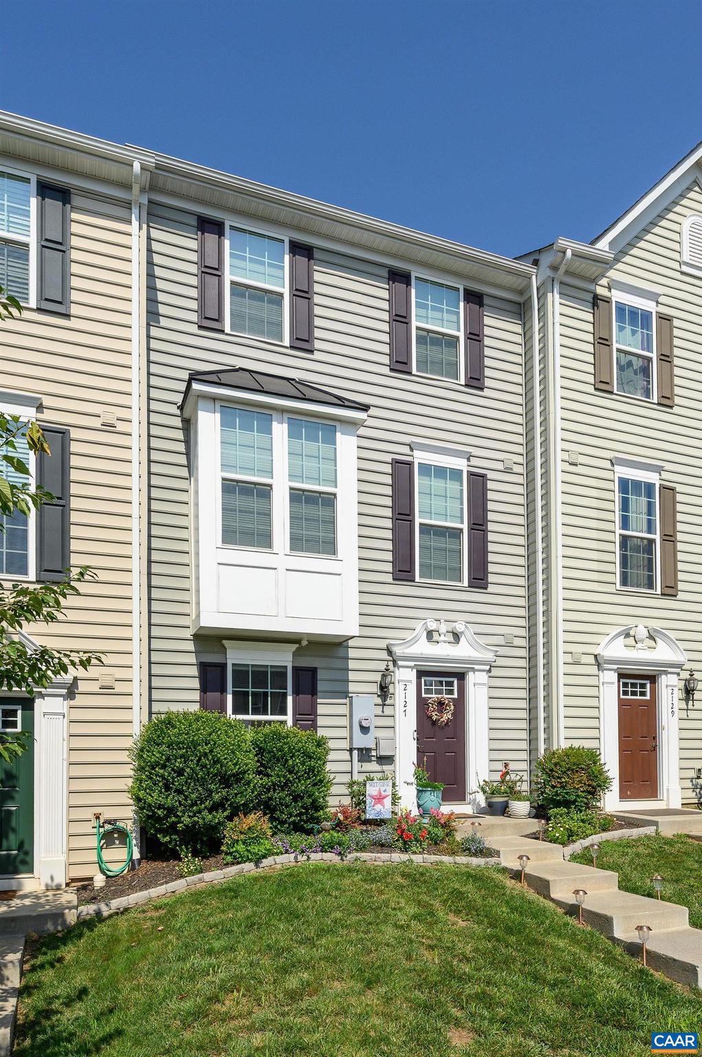 Welcome to 2127 Elm Tree Knoll, one of the largest townhomes in the Riverwood neighborhood, located conveniently across from NGIC, minutes from Hollymead Town Center and Cville airport, and less than 20 minutes to UVA and Downtown Charlottesville. This like-new, one-owner home has been meticulously maintained and features a long list of upgrades. Levels one and two, including both staircases, have gorgeous hardwood flooring, while the third level features nearly new carpeting. In the gourmet kitchen you'll find timeless white cabinets with granite countertops, a generous island for gathering, a large pantry, and all new appliances. During construction, owners extended the kitchen to include a built in bar and a spacious sitting area with a great view of the rear yard. Other notable upgrades include an oversized primary bath with soaking tub and new shower doors, beautiful bay window in the living room, gas fireplace in the family room, custom blinds, closet organizers in the primary and guest bedrooms, and fresh paint throughout. The rear yard is a relaxing oasis with a new trex deck, fencing on both sides for privacy, and beautiful landscaping. HOA covers lawn care in the front. Wonderful playground in the neighborhood!,Granite Counter,White Cabinets,Fireplace in Basement
