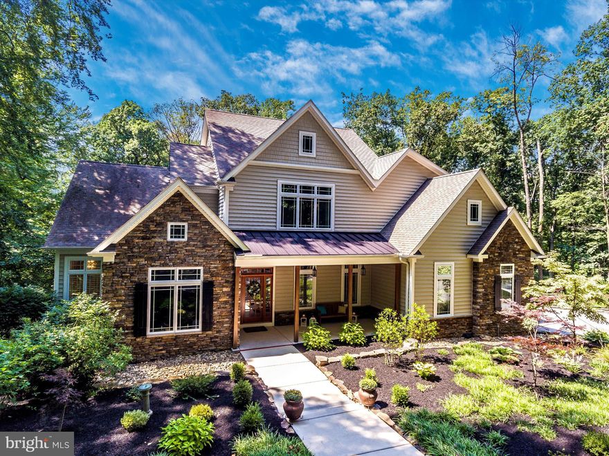 Absolutely Stunning custom residence with separate cottage in the heart of historic Birchrunville, offering outstanding construction and design quality. Privacy-Seeker’s Paradise, Nature-Lover’s Retreat! Enter the circular drive, and sylvan settings encircle you in every season. This exquisite home is designed to enjoy the seasonal views from over 6500 sq. ft. of inviting interior space. The unparalleled features create a quality of life that is paramount for today’s lifestyle standards! Enter the main home through a covered porch and into the center hall flanked by a formal dining room with tray ceiling, and study with privacy glass door and wood beamed vaulted ceiling. The first floor has beautiful hickory wide plank hardwood, and there is extensive millwork throughout the home. The dramatic living room features a vaulted, coffered ceiling, overlook from the 2nd floor, and a 2-way gas fireplace that is shared with the stunning master bedroom. Extensive windows and French glass doors offer panoramic views of the serene landscape of the property and access to the beautiful deck. Any chef would appreciate the elaborate gourmet kitchen, featuring a butler’s pantry, huge granite island with prep sink, 2 ovens, a 6-burner propane stove, built in microwave, warming drawer, walk-in pantry, breakfast room and great room with stunning wood-burning stone fireplace. The luxurious master suite has a coffered ceiling, French doors to the deck, a newly updated bath and 2 custom walk-in closets. There are 2 powder rooms, a back hall, a laundry room, and entrance to the 2-car garage on this level. The wood staircase takes you to the 2nd floor, featuring an additional Master Suite with separate sitting room, walk-in closet and luxury bathroom. Two additional spacious bedrooms with walk-in closets are joined by a Jack & Jill bath. The newly finished walk-out basement includes a bar/kitchen area with wine cooler, ice maker, microwave and dishwasher. A beautiful stone fireplace, full bath, huge game area for all your “toys”, and French doors to the exterior patio complete the finished space. There is plenty of storage in the unfinished section. The main home has extensive recessed lighting, 2-zone HVAC supporting the first floor and basement, a separate HVAC unit for the 2nd floor, 2 hot water heaters, and a whole house generator that will run both the home and cottage in the event of a power outage. The guest cottage is a charming retreat for family or friends, au pair, artist, home business…. Or use your imagination! It features a full kitchen, great room with French doors to the deck, a bedroom with walk-in closet, laundry facilities, and a full bath with tile shower. A separate HVAC unit and water heater are dedicated to the cottage. There is a spacious 3-car garage beneath the cottage for your antique car collection or workshop, and invisible fence to keep your pets safe!