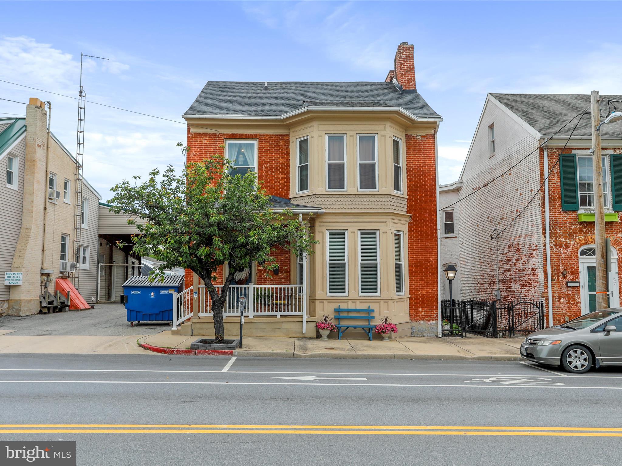 Could this be your next home, Airbnb, or investment opportunity? The possibilities are endless! The current owners have loved seeing this downtown Williamsport home come to life and now it's your turn to make the next move! Although it is currently used as a primary residence it was previously used as a mixed use building with a shop on the main level! The home has gone through major renovations in the last 10 years to include an updated kitchen and baths (with exception of 1), window (most) replacements, metal garage roof, custom paint colors, and finished attic space! The home has two welcoming options for primary bedrooms with attached full baths! The main level features high ceilings, 2 fireplaces (not currently in use) and a grand entrance complete with designer choice wall paper imported from the UK! There is a 10+ space detached, brick garage that has recently been used to host private parties; however, this flex space would be fabulous as a garage, dance studio, or meeting spot! The rear yard acts as a private oasis with a covered deck and partial privacy fence! Allow Williamsport to become your local outdoor playground with access to the C&O Canal and Cushwa Basin, Potomac River, Conocheague Creek and Byron Memorial Park! This town is loved for its cycling, jogging, hiking, biking, fishing, kayaking and boating opportunities! Minutes to I-81 and I-70! THIS HOME COULD BE ELIGIBLE FOR TAX CREDITS FOR DIFFERENT TYPES OF RESTORATION AND ALSO A FEDERAL TAX CREDIT FOR INCOME PRODUCING PROPERTIES