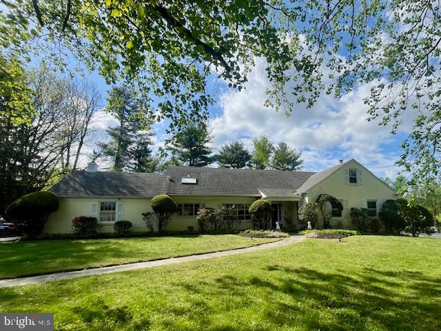Tucked away on a gorgeous block in a quiet cul de sac, this spacious 4-bedroom, 3.5-bathroom home offers a rare combination of character, functionality, and opportunity. Ideally located within walking distance to Welsh Valley Middle School, the home welcomes you with beautiful hardwood floors that flow throughout the main level. A handsome home office with classic wood paneling and built-ins provides the perfect space to work from home. The expansive living room features floor-to-ceiling windows, a fireplace, and gleaming hardwoods, creating a bright and inviting atmosphere. Entertain with ease in the nicely sized dining room, accented by a chandelier and large windows.
The majority of the bedrooms are located on the first floor, along with a convenient laundry room and ample living space. Upstairs, the private primary suite includes a spacious bathroom, while a truly unique second-floor room—reminiscent of a banquet hall—boasts soaring ceilings with exposed beams and a second kitchen, offering endless possibilities for entertaining or guest accommodations.
The full, unfinished basement includes a bathroom and exterior egress to the backyard, where a pool awaits your summer enjoyment. With an attached garage, driveway parking, and classic curb appeal, this home is ready for someone to make it their own and add their personal touches. Don’t miss the chance to create your dream home in this exceptional location.