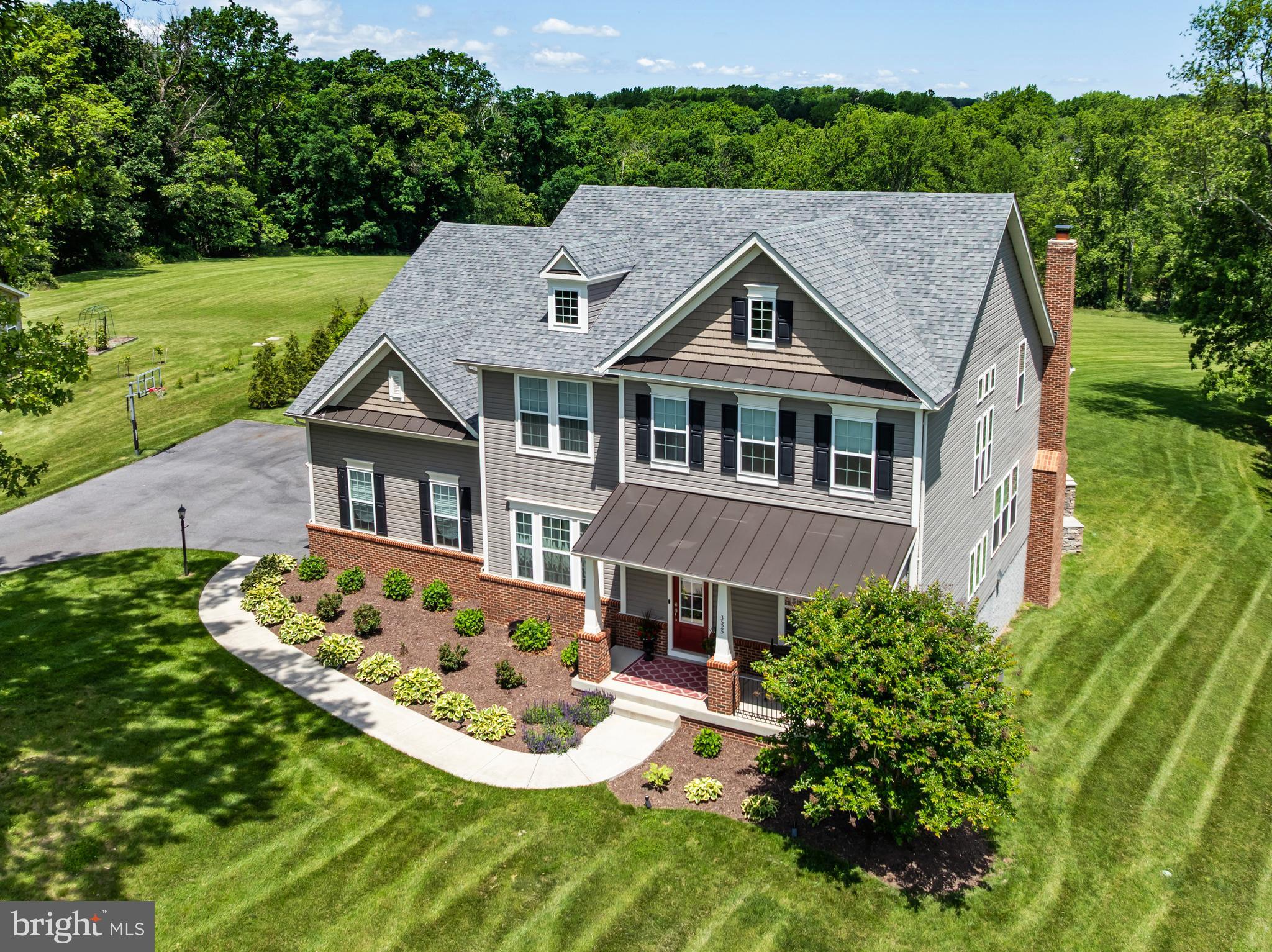 Absolutely STUNNING property located on 3 acres at the end of a beautiful cul de sac backing to forest conservation. Drees coveted Monticello model offering over 6000 square feet of luxury and comfort throughout. Exquisite attention to detail. Subzero and Wolf appliance package, multiple custom fireplaces, hardwood floors throughout the main and upper levels, luxury owner's suite and more. The thoughtfully designed floor plan is the perfect home for entertaining and large gatherings. 10 ft ceilings, added sunroom option, 16ft coffered ceiling in family room with a wood burning fireplace and custom stone mantle, incredible upgraded kitchen with oversized island, open to its AMAZING outdoor living space with outdoor kitchen, fireplaces, covered deck, custom pizza oven and so much more. The photos are a must see. Fully finished walkout basement with large rec room, gym, full bath and tons of storage space. 3 car oversized garage. Excellent location. Close to 70 and 270. Urbana High School district!