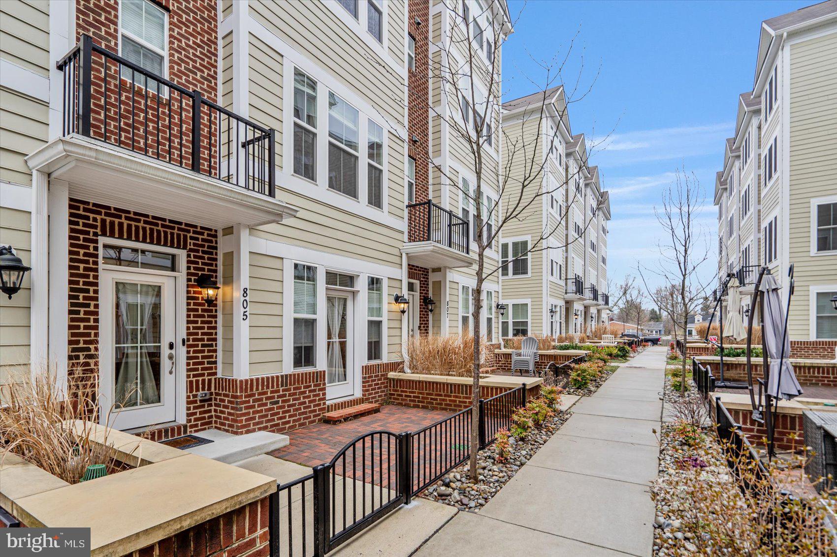 Beautifully maintained 3BR 5 BA, stunning Townhome located in the desirable community of Annapolis Townes at Neal Farm. Stroll the sidewalks to the gated front patio and open the door into four floors of pristine living space, and your new home. The entry level welcomes you into a bright sitting room/office, a half bath, access to the two-car garage, and features stunning engineered hardwood floors that continue onto the main floor. The living space on the main floor consists of an open floor plan offering a spacious dining room, stunning kitchen, a half bath, and a large living room with a gas burning fireplace and access to the first of two balconies. The kitchen features plenty of cabinets finished with crown moldings, a separate pantry closet, stainless steel appliances including a gas double oven freestanding stove, sleek granite countertops with a complementing backsplash, and a stainless sink set into a large center island with glamorous pendant lights and breakfast seating for four. The stairways leading to the two remaining floors have been newly carpeted as well as all three bedrooms. The second floor features a spacious primary bedroom with a large walk-in closet and private ensuite boasting a double sink vanity and a beautifully tiled walk-in shower with a built-in bench. The secondary bedroom also features a private ensuite with a full bath and large closet. And for your convenience this floor features a laundry closet. Just up a few more steps is the fourth floor which offers a large family room with access to a large deck, and third bedroom with another private ensuite boasting a walk-in shower. This home is move-in ready, ideal for any new homeowner, and is located in close proximity to shopping restaurants, and commuter routes.