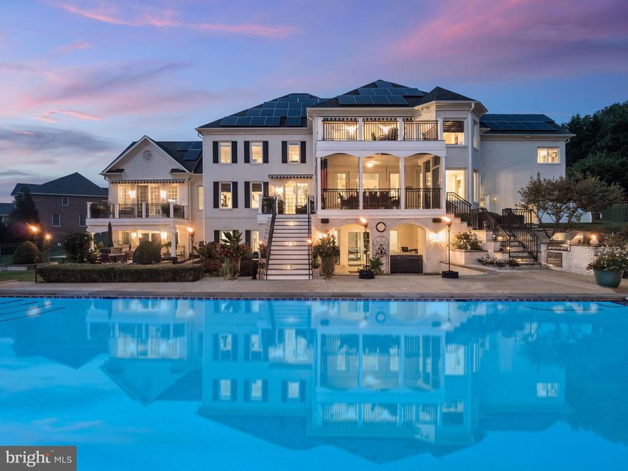 Welcome to 1115 Thomas Swann Lane, an extraordinary custom estate located in the prestigious Governor’s Manor community of Davidsonville. Nestled on 2 serene acres backing to 67 acres of protected woodland, this Baldwin-built masterpiece has been transformed by over $1.5 million in high-end renovations completed by Annapolis Green Construction and HD Squared Architects. Offering six spacious bedrooms and six and a half baths across three finished levels, the home blends elegant design with cutting-edge technology and resort-style amenities for unparalleled luxury living. The grand entry sets the tone with a dramatic two-story foyer featuring a stunning new chandelier that lowers electronically for easy maintenance, along with solid wrought iron front doors equipped with a Wi-Fi-enabled locking system. Inside, the heart of the home is the show-stopping gourmet kitchen, featuring custom, handmade Craft-Maid cabinetry, a 60” Wolf professional dual fuel range with griddle and grill. Sub-Zero, Miele, and Wolf appliances, a walk-in pantry, oversized granite island, and a custom wet bar with a Scotsman clear ice maker and wine refrigerator. The kitchen opens to a large, screened porch—ideal for relaxing or entertaining—and the home also boasts multiple decks throughout, three of which feature retractable awnings for added shade and comfort. The dramatic two-story family room boasts a gas fireplace, large 8k TV, JBL sound system, and motorized retractable awning with wind sensors. A stately home office/library with French doors, a formal dining room with crystal chandelier, and a conservatory/billiards room with soaring ceilings and Definitive Technology speakers offer both function and flair. Upstairs, the luxurious owner’s suite is a true retreat with a gas fireplace, private deck access, blackout silhouette blinds, coffee and wine bar, and an opulent spa bath featuring a steam shower, Bain Ultra tub, heated floors and towel rack, dual vanities, and a walk-in laundry closet. Fall in love with the custom, handcrafted his and hers extra-large closet! Additional bedrooms offer hardwood flooring, en-suite, Jack-and-Jill bedroom and bath, and a office/craft/bonus room. The lower level is equally impressive with a full in-law/au Pair suite complete with kitchenette and private entrance, a professional-grade movie theater with acoustic panels and bass traps, 82” 8K TV, reclining leather seating, concession stand, and a home gym or 6th bedroom. Relax in your private 6-person sauna. Throughout the home, enjoy SMART Home features such as integrated Definitive speakers each paired with Yamaha MusicCast wireless amps, Cat6 wiring in every room, a UniFi network with battery backup, and Samsung SmartThings automation for seamless control. Step outside to your own private resort featuring a resurfaced and tiled, heated 40,000-gallon gunite pool with stunning new Azure tile, a tranquil waterfall feature, and an electric cover for convenience and safety. Unwind in the private HotSpring hot tub or entertain with ease in the expansive pavilion, complete with a fully equipped outdoor kitchen and a 12-person bar adorned with marble and quartz countertops. Premium Blaze grill equipment, stainless steel appliances, and a lighted copper cupola elevate the experience. A dedicated full pool bath with its own mini-split HVAC system ensures comfort for guests year-round. A three-car garage, whole-house generator, solar panels, 3-zone HVAC & 2 mini split units, 1000-gallon propane tank, and a 121-head irrigation system complete the estate’s unmatched infrastructure. Smart, secure, and exquisitely designed, this fully fenced property offers both comfort and sophistication. Located just minutes from Annapolis and major commuter routes to Washington, D.C., and Baltimore, with an annual HOA fee of $1,500 covering road maintenance, common areas, and community signage. This is not just a home—it’s an extraordinary lifestyle opportunity.