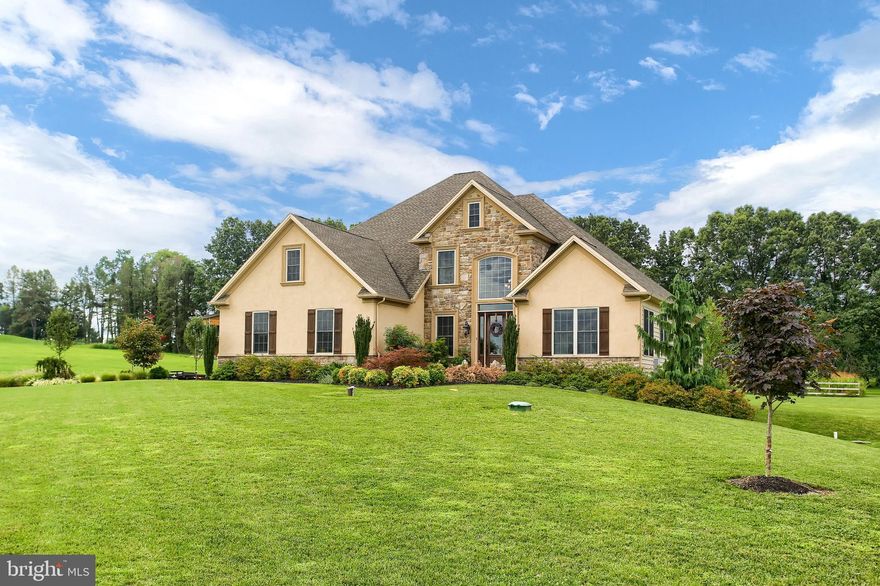 A beautiful custom built home  located in a rural setting yet close to shopping and dining.  Only 6 years young it offers a first floor master suite with cathedral ceiling & cove lighting and 3 other bedrooms, 2 full bathrooms and craft/home schooling room on the second level.  It also includes a beautiful gourmet kitchen with SS Kitchen-Aid appliances soft close doors & drawers, island and under cabinet lighting,  double sided gas fireplace in the 2-story great room with coffered ceiling, beautiful wood and tile floors, 1st floor laundry, security system, 2 acre lot, 3 car garage,  covered stamped concrete patio, gorgeous landscaping, full basement of over 2000 sq. ft. to finish for more living space or to use as storage.  You must see and experience this property!