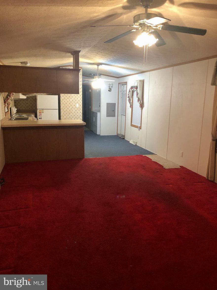 2 bed, 2 bath mobile home with stand up shower, open kitchen possible bar, plenty of storage, shed, deck, ramp to deck, home warranty, convenient to shopping, malls, 695, 43, and 95. Buyer's must be approved by the community, application fee $50 per applicant 18 years and older, small pet welcome,