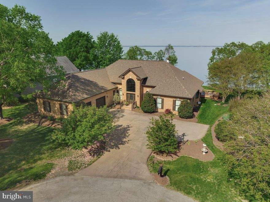 Potomac River Waterfront Retreat with Private Pier in Swan Point
Enjoy waterfront living in this all-brick custom home overlooking the Potomac River in the sought-after Swan Point Yacht & Country Club community. With over 3,300 square feet of single-level living space, this home offers beautiful sunset views and a relaxed waterfront lifestyle.
The home features a barrier-free layout with step-free entry and wide hallways for easy single-level living. Large windows fill the space with natural light and offer water views from many rooms. The open-concept living and dining areas are anchored by a gas fireplace, creating a comfortable and inviting space for everyday living and entertaining. 
The award-winning custom-designed kitchen will impress even the most discerning chefs and overlooks the sun-room—sure to become a favorite gathering spot in the home. The kitchen features high-end appliances, a wine refrigerator, and a walk-in pantry with custom cabinetry.
Outdoor living is a standout feature. The expansive deck and sun-room overlook the river and provide the perfect place to enjoy sunsets.  Property includes a private pier with boat lift and two jet-ski lifts offer direct access to the Potomac for boating and waterfront recreation.
The primary suite includes a fireplace and expansive views of the historic Potomac River. The ADA-inspired en-suite bath features a step-in shower, a separate step-in soaking tub, and a spacious layout designed for comfort and accessibility.
Residents of Swan Point Yacht & Country Club enjoy access to an 18-hole championship golf course, clubhouse pub and restaurant, marina, pool, tennis courts, pickle ball courts and walking trails. Located about 90 minutes from Washington, D.C., this home offers a peaceful waterfront setting with resort-style amenities. PHOTOS COMING