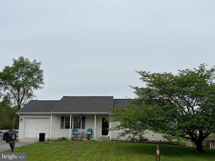 UNDER $300K in MARTINSBURG, WV!!  THIS HOUSE IS IMMACULATE!! They have done so much work to it! Enjoy the front porch on a quiet street or relax on the back deck with your morning coffee. Walk into the LARGE living room w/ coat closet! The kitchen has added counter and cabinet space and plenty of room for a table. Walk back the hallway and you are greeted with three bedrooms, hall closets and hall bath. The master bedroom is HUGE and includes a full bath. The stairs to the basement are one of the seller's favorite things in this house! They really are very pretty. The basement has been improved (heat and a/c) and is finished with a rec room (there is a space for a pull down movie screen) a workshop type room and what could be another bedroom!  The built in pantry is AMAZING. Also includes the laundry area & a freezer. It is a walkout basement that exits to the very nice back yard with water feature, shed and flower gardens. Roof and gutters are ONLY 2 YEARS OLD - with 50 YEAR WARRANTY!