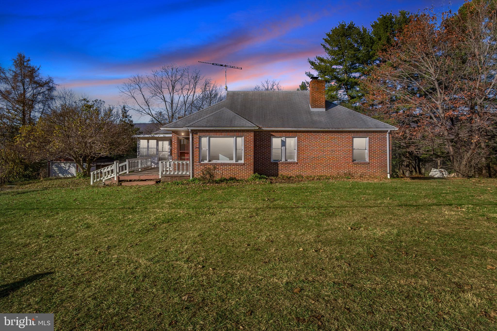 Welcome home, 12724 Wolfsville Rd. offers a rare combination of peaceful country living with easy access to town. Nestled in the scenic shadows of South Mountain, the all-brick rancher sits on nearly 2 acres of land, providing breathtaking views both front and back. The property features a large two-story garage, perfect for additional storage or workspaces.
Step inside to discover a home rich with local history. The hardwood floors, window and door trim, kitchen cabinets, and built-ins were all crafted at the Morgan Planning Mill, which once stood at the site of the current Wolfsville Ruritan. These unique touches bring character and craftsmanship to every corner of the house.
The open and airy main level is bathed in natural light. The spacious kitchen is designed for both functionality and style, while the adjoining dining room is ideal for family gatherings or cozy game nights. The expansive family room offers plenty of windows that provide stunning views of the surrounding mountains and yard. The central living room offers a convenient space for relaxation, and the three bright and spacious bedrooms, along with a full bathroom, complete the main level.
The walkout lower level, currently used as a wood shop, offers endless possibilities as additional living space, storage, or a hobby area. The attached single-car garage and firewood room further enhance the practicality of this home.
Outside, the peace and tranquility continue with an expansive front porch and a screened-in porch, perfect for enjoying the views or visiting with neighbors. The private backyard, with stunning mountain vistas, offers plenty of space to explore or relax. The home is ideally located near major commuter routes, and is just minutes from Frederick, Hagerstown, Thurmont, Smithsburg, and Waynesboro, with easy access to shopping, dining, and even the Appalachian Trail.
Don't miss this opportunity !