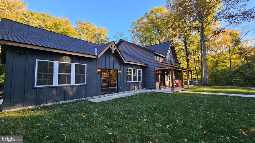 Totalling gorgeous renovation tucked away on acres of privacy and beauty.   This custom home was designed and built for maximum enjoyment of the property.  Expansive family room addition with soaring ceilings and outdoor spaces front and rear to create outdoor spaces to be as one with nature.   Treat yourself to a tour and make it your new home!