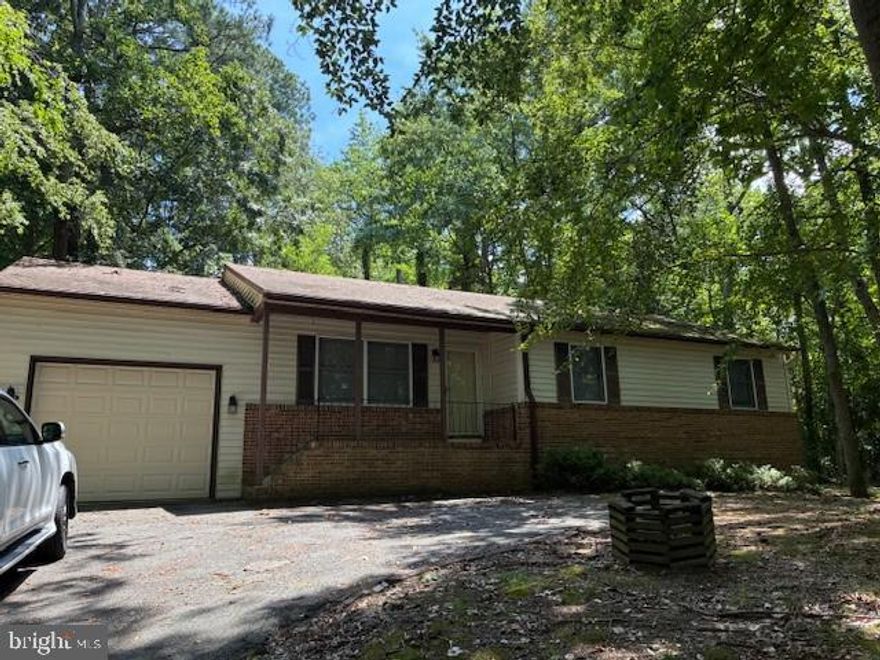 Great rental in the heart of lovely Drum Point community. This home has a large private, wooded lot, 1 car garage space, large front porch and well-appointed back deck overlooking nature. Interior features huge family room, 3 bedrooms and 2 full baths, plus kitchen with dining table space, and separate laundry room. All on one level or easy living. Community features boat ramp, beach and seasonal water views. Close to nature and Town of Lusby for shopping, dining and more. *** Home will have exterior professional power washing next week.***