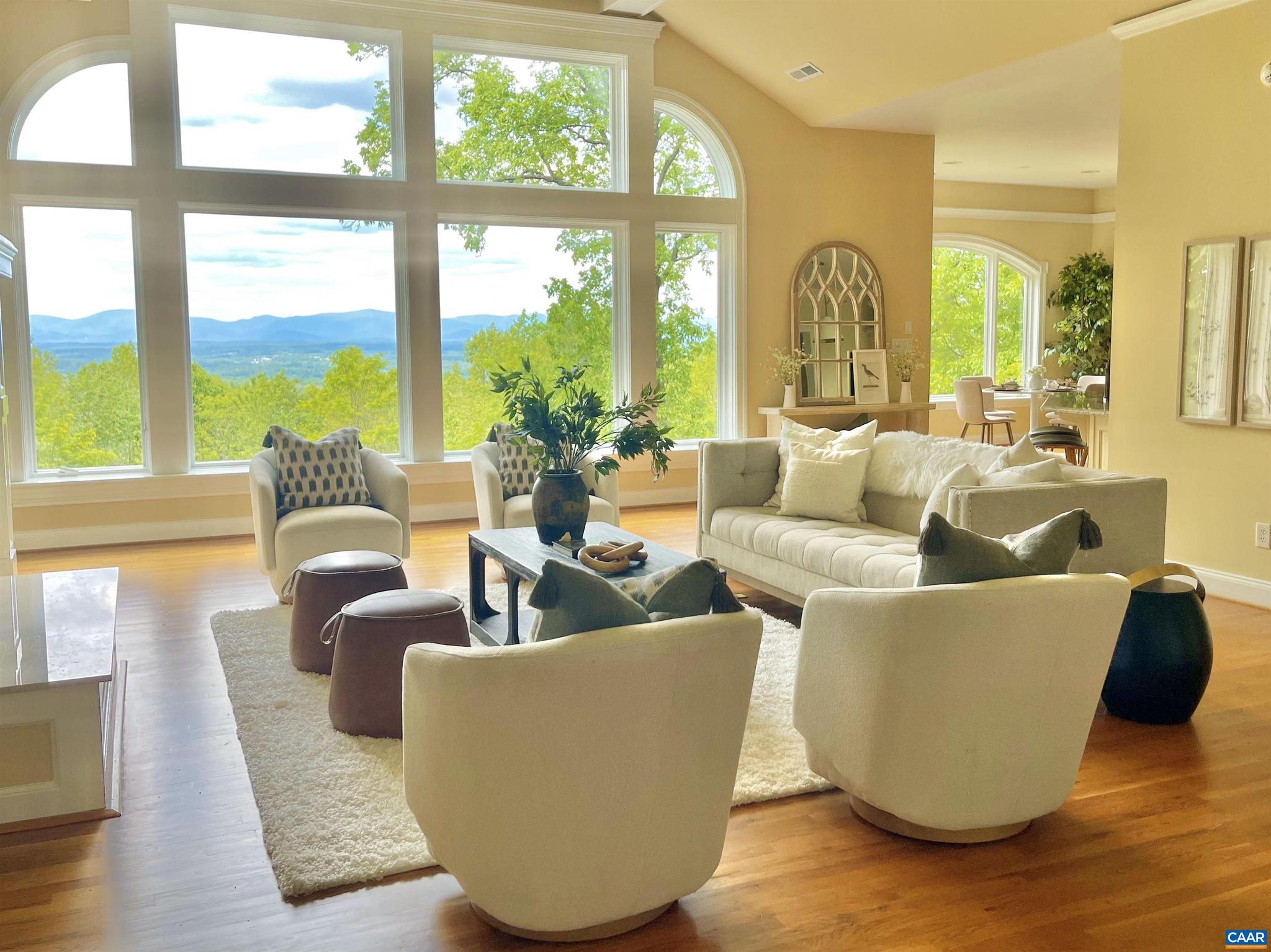 Spectacular Views and wonderful space in this 2007 custom designed 8400 sq.ft. home with many outstanding features. NEWLY UPDATED AND STAGED. Enjoy the luxuries which include a primary ensuite with fireplace and private deck with view, hand laid hardwood floors, additional fireplaces, built-in-cabinets, library, theatre room, family room with mini kitchen, rec/game room in basement roughed in central vacuum, elevator and three car garage. A spacious office over the garage with private entrance is current for today's buyer working from home. Enjoy the natural beauty of the area and views from your covered porch and abundant decks. A large home on a premium lot in a sought after community only 10 minutes to downtown Charlottesville.,Granite Counter,Painted Cabinets,Fireplace in Family Room,Fireplace in Master Bedroom