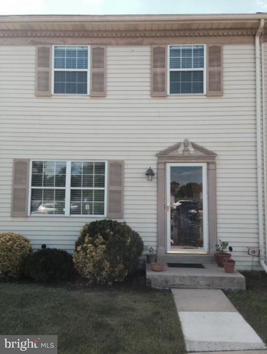 Upgraded laminate flooring on first floor, central air, ceramic tile details in kitchen and bathroom, private patio overlooking Waterfront River and Flory Park with pavilion, playground, walking trails.  Two parking spaces, 1st FL laundry, Pella patio doors. Beautiful move-in ready home! Must see!