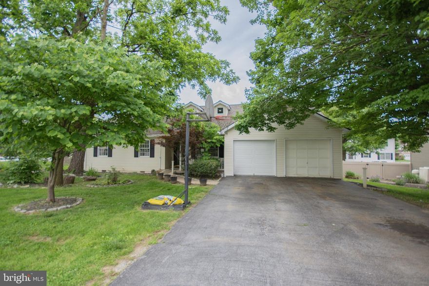 This 3-bedroom, 2-bath rancher is located in the sought-after Spring Mills community and offers over 1,500 sq ft of comfortable living. Step outside to a spacious rear deck, fully fenced yard, and well-kept landscaping—perfect for relaxing or entertaining. Community amenities include a pool, playground, tennis courts, and walking trails. Conveniently located near schools, shopping, and commuter routes - Don't miss this one!