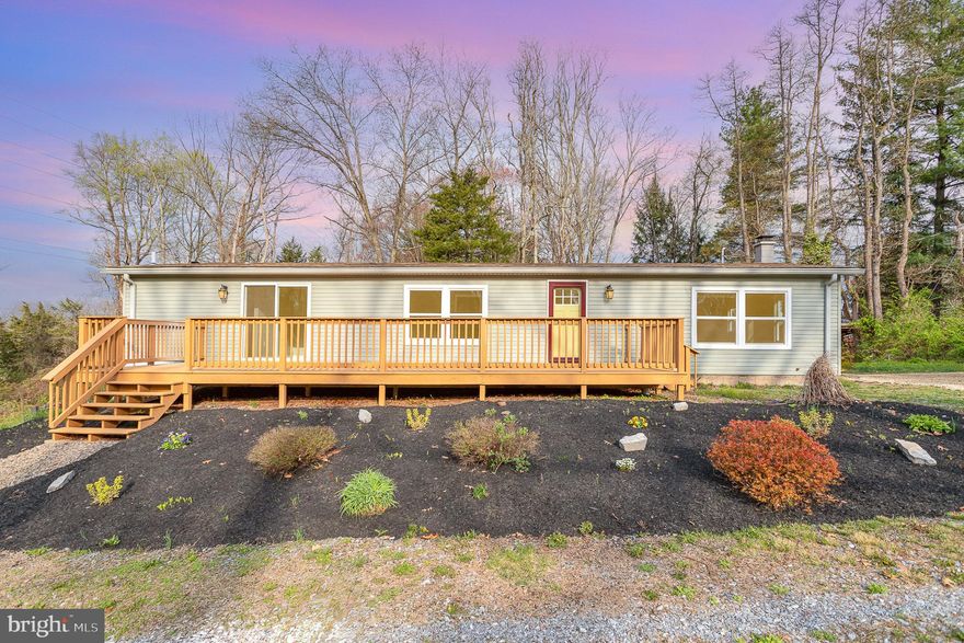 Offer deadline at Noon 4/21 - Presentation at 3PM on 4/21 - Welcome home! Nestled on a serene 2.71-acre parcel, this newly remodeled home offers the perfect blend of modern luxury and secluded tranquility. Step inside to a spacious living room with optional office/playroom adjacent. Kitchen with new white cabinetry, granite counter tops and island, tile backsplash and new S/S appliances. Utilize this area to your liking with ample space for a dining room/breakfast room setup. Main level living is completed with 3 bedrooms, laundry area with sink and 2 full baths. Primary bedroom intelligently designed with walk-in closet and an en-suite full bath featuring tile walk-in shower. Enjoy your morning coffee in privacy on the front or rear deck. If you like seclusion, this setting will not disappoint. Full, unfinished, walk- out basement ready for your imagination and personal design, spacious enough for both additional living space and storage. OPEN SATURDAY 11AM to 1PM. Don't miss this opportunity!