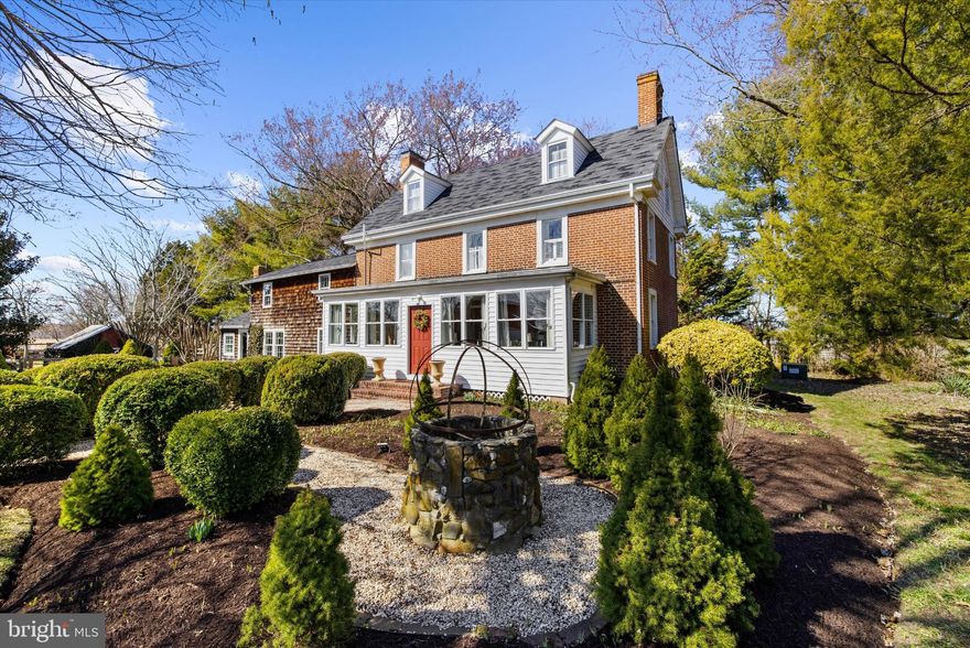 Coming soon - a rare offering nestled immediately outside of Church Hill.  This distinctive property combines history, privacy, and complete freedom of use on over three picturesque acres in Queen Anne’s County. With no HOA, or covenants and restrictions, you have the flexibility to create the lifestyle you’ve envisioned—whether that includes animals, expansive gardens, hobby spaces, or simply room to breathe.

A scenic, tree-lined drive welcomes you to a timeless Colonial residence originally built in 1735. Inside, more than 2,800 square feet of living space blend preserved historic details with modern enhancements. Original hardwood flooring, exposed brick accents, hand-hewn beams, and a charming wood-burning stove reflect the home’s heritage, while thoughtful updates and a completely renovated kitchen provide everyday comfort.

The main level also includes a formal dining room, spacious living room, full bath, and a bright all-season room overlooking the grounds. Upstairs, you’ll find two generously sized bedrooms, a dedicated office or optional fourth bedroom, and a third-floor retreat offering two additional flexible rooms suited for bedrooms, studios, or creative workspaces.

Outbuildings add exceptional versatility to the property, including a substantial pole barn with electricity, a historic granary equipped with water and electric, a chicken coop, and multiple additional structures ideal for storage, workshops, or hobbies. The grounds are beautifully maintained, offering a park-like setting with mature landscaping, open lawns, and garden spaces. A custom fire pit creates the perfect backdrop for peaceful evenings, and a fenced rear yard adds convenience and comfort.

Recent improvements include new kitchen, interior paint, upgraded appliances, an on-demand propane hot water system, a new deep well and well pump, and a septic system installed in 2019.

Set among scenic farmland yet just minutes from Route 301, this remarkable Church Hill property offers both serenity and accessibility—an uncommon opportunity to own a historic home with acreage and unrestricted potential.