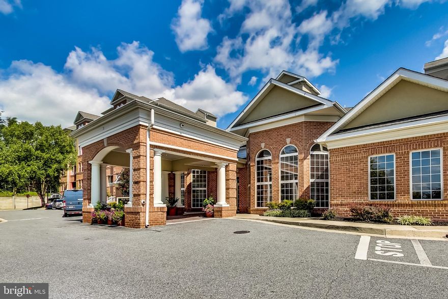 Luxury and convenience meet in this upscale High View at Hunt Valley corner-unit condominium. Enjoy one-level living in this updated 2-bedroom, 2-bathroom home overlooking the fabulous, lushly landscaped courtyard and fountain. Amenities galore including on-site management and concierge, attached parking garage with conveyed reserved space (#1149), outdoor pool, enhanced fitness center, club/party room, conference room, rooftop tennis courts, business center and so much more. 
Work from home at your built-in desk in the oversized kitchen, featuring a full appliance package and plenty of space. Access to the serenity of your balcony is granted through both bedrooms and sliders in the living room. Gas fireplace warms up your freshly painted space in the living area. Separate dining space off the kitchen with hanging light. Two spacious, bright bedrooms, both with attached full bathrooms and expansive closets offer the ideal floorplan. Primary ensuite bathroom includes two vanities with full sinks, a soaking tub, and separate stand-up glass enclosed shower. Second bathroom offers full-size tub/shower and open single-sink vanity.
Perfectly located walking distance from the Hunt Valley Town Centre – home to Wegmans, HomeGoods, Dick’s Sporting Goods, movie theaters, tons of restaurants and bars and every store you could need. Enjoy the life of elegance and ease here at High View at Hunt Valley.