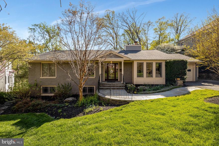 A hidden gem on a private, 0.7-acre lot in the highly desirable Salona Village, this exceptionally renovated home offers a tranquil, tree-house oasis overlooking Pimmit Run. An extensive addition nearly doubled the size of the original structure, resulting in a residence with nearly 4,000 sq ft of sophisticated living space, featuring 4 bedrooms and 3 full baths.
This two-level home features hardwood floors and an open floorplan, with cathedral ceilings and oversized windows, with two bedrooms and two baths on the main level. The open kitchen, with direct access from the attached garage, is equipped with professional-grade Viking appliances, an undercounter wine cooler and plenty of counter space and cabinets, including a full wall of custom pantry built-ins. The family room with gas fireplace, dining area and separate living room, with gas fireplace complete the main level. 
Multiple rooms on both levels open to a spacious hardwood deck, and the fully finished, walk-out lower level, with a large, open rec room with wood-burning fireplace, flows out to a stone patio with a custom waterfall feature—perfect for relaxing or entertaining. Two bedrooms, also perfect for a home office, exercise space or private den, a full bath, and plenty of storage, round out the lower level.
While offering a private setting, surrounded by mature landscaping and wooded views from the back, the home is just minutes to downtown McLean and Tysons Corner as well as major commuter routes, with easy access to the Silver Line Metro, DC and both area airports. Professional landscaping surrounds the house, ensuring year-round beauty and privacy. From the street, the home’s understated exterior gives little hint of the peaceful tree-house oasis that awaits inside and behind the house—an exceptional find inside the Beltway. McLean High School pyramid. Public water, public sewer.