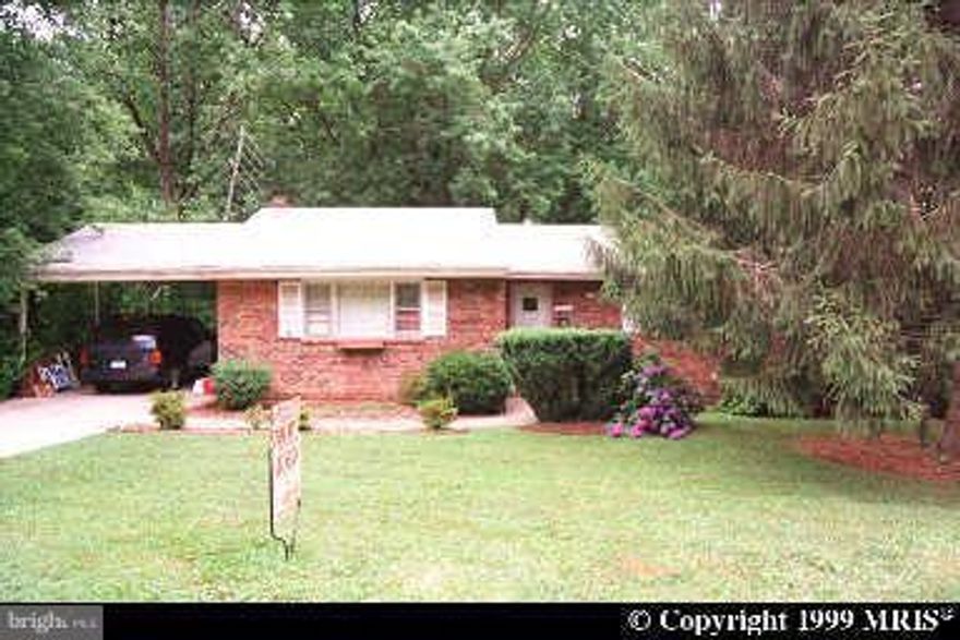 Large rambler with walk-out basement situated on quiet treed lot, conveniently located inside the Beltway.  Main level bedrooms, with master bedroom, separate dining room, lots of space, large family room w/fire place on lower level.  Backs to woods.