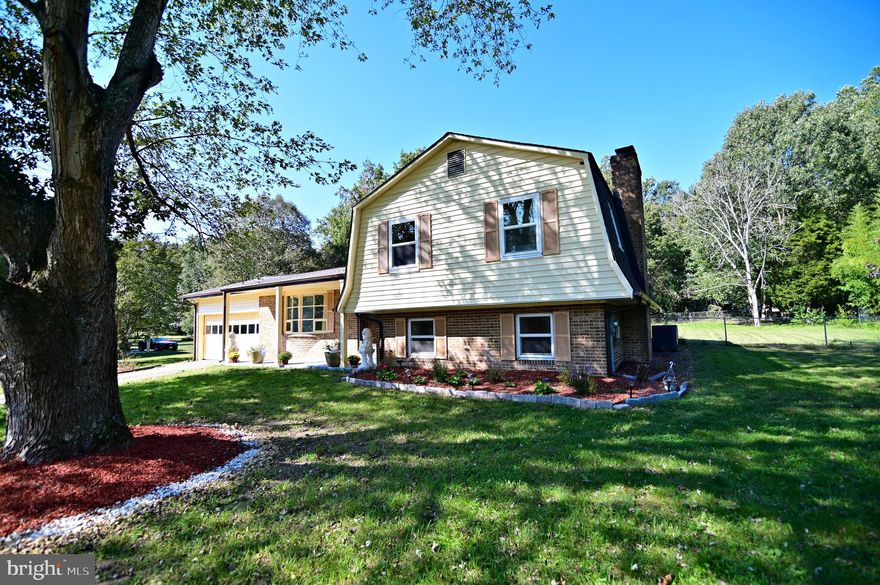 BACK ON THE MARKET!!!  BUYERS FINANCING FELL THROUGH.  SPREAD OUT IN THIS SPACIOUS SPLIT LEVEL.   GORGEOUS UPDATED KITCHEN W/ GRANITE COUNTERS, STAINLESS APPLIANCES.   GLEAMING  HARDWOOD FLOORS ON MAIN LEVEL.   HUGE BASEMENT REC ROOM WITH A COZY FIREPLACE--GREAT FOR ENTERTAINING.   NEW ROOF, 5 YEAR YOUNG SEPTIC, NEWER WINDOWS, AND HVAC.  LARGE LEVEL YARD FRONT AND REAR.  SOLD AS-IS, IN GREAT CONDITION.