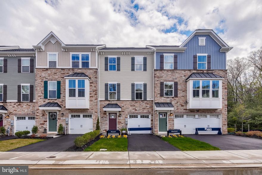 Former Model Home. This Garage townhome is spacious & features 3 bedrooms, Garage, Finished Rec Room w/ half bath & walkout to flat yard facing trees. The main level consists of an eat in Kitchen with Granite Countertop, Stainless Steel Appliances, Open Concept with 9' ceilings & Slider leading to Composite Deck. Upstairs you will find 3 Bedrooms 2 Full Baths & a Laundry Room.  Shaw's Discovery Community features a fishing pier, community pavilion and walking trails all while being surrounded by beautiful forest conservation. For the boating enthusiast, there are countless marinas located within minutes of this home!  Builder Warranty is transferable. Hurry this will not last long!