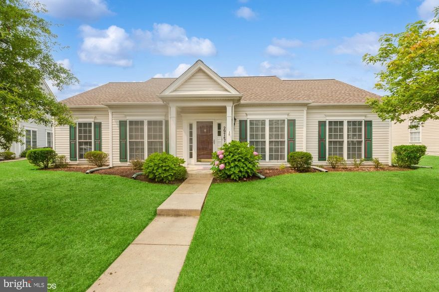 Here is a "must see" opportunity to live in Easton Club East.  As you cross the threshold, this lovely  2-bedroom, 2-bathroom rancher turns on the charm. Hardwoods provide warm flooring in the entryway of the dining room and kitchen, reflecting sunbeams of light. The efficient gas fireplace imparts a cozy feel to the living room, creating a great spot for reading or a nap. The large kitchen features marvelous counter space, along with a classic island configuration that maximizes workspace and flexibility. The entire scene looks beautiful beneath warm natural light. The primary bedroom offers welcome tranquility as the days begin. In addition to the convenience of the private bathroom (separate tub), you will find ample closet space. The other quiet bedroom offers the convenience of ground floor accessibility. Enjoy your lovely sunroom with a slider to the low-maintenance yard that is easy on the back, wallet, and schedule. A driveway with ample accommodation for two vehicles leads to an attached two-car garage that is available for its original purpose or for use as additional flex space. From the front door on a pleasant street lined with sidewalks, this home is headquarters for access to an array of local amenities, such as shopping, restaurants, arts, movies and so much more.  Easton Club offers a community center with a ballroom and dance floor, movies, hosting events and presentations. The clubhouse also features a fitness center, billiards room, library, card, arts and crafts room, kitchen, and a beautifully furnished patio between the clubhouse and outdoor pool. The only missing ingredient is you! Call for a  private showing.