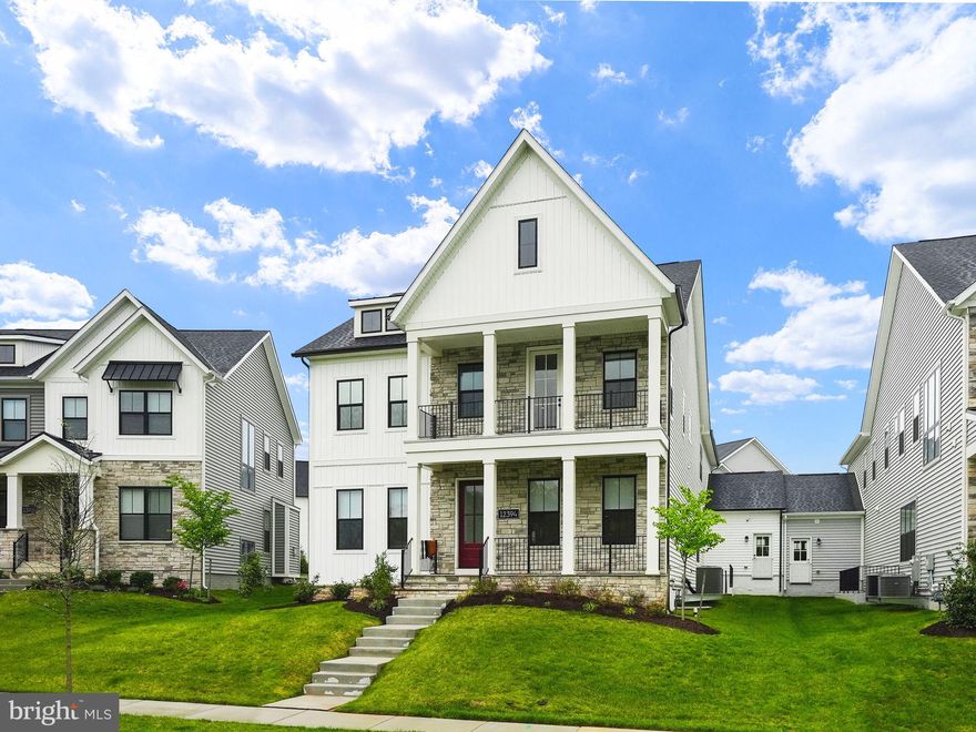 Welcome to 12394 Potomac Hunt Rd, where luxury living reaches new heights! Prepare to be captivated by this designer masterpiece boasting over $450,000 worth of upgrades, making it the crown jewel of the Hamlet collection and truly the epitome of luxury living.
This award-winning Travilah model home showcases custom details at every turn across its three fully finished levels. As you approach, you're greeted by the allure of double Flagstone Front porches, setting the tone for the grandeur that lies within. Situated on one of the most coveted lots in the community, revel in the serenity of the lake view and daily sunsets from your own private sanctuary.
Step inside to discover an expansive open layout adorned with exquisite Williamsburg oak stairs and modern hardwood floors throughout. The heart of the home, the living room, features a striking 42” Cosmo Linear fireplace, creating a captivating focal point. Extend your entertainment outdoors through the 12’ Multi-Panel Stacking Door, leading to the Luxury Outdoor Living Patio enveloped by custom landscaping and a fenced backyard for utmost privacy.
The gourmet kitchen is a culinary haven, equipped with Chef's Ultra Kitchen appliances including a Wolf 48” Dual Fuel Range, 30” Wolf built-in dual oven/microwave, Cove Dishwasher, and Sub-Zero French door refrigerator. Indulge in the 3-inch waterfall quartz overhang countertops, custom cabinets and handles, under cabinet lighting, and a butler pantry, all meticulously designed for both beauty and functionality.
Venture downstairs to the fully finished basement, where over 1685 sqft of space awaits your imagination. Whether it's a guest suite, home theater, or personal gym, the possibilities are endless. Unwind in the dry sauna all while enjoying the luxury of convenience and comfort right in your residence.
Retreat upstairs to the primary bedroom suite, boasting a private covered porch, spa-like bath, and expansive walk-in closet. Three additional spacious bedrooms, each with its own walk-in closet, ensure ample space for the whole family. The convenience of a dedicated laundry room with top-of-the-line LG Signature line washer and dryer appliances adds to the allure of this exceptional residence.
This one-of-a-kind home comes complete with $22,000+ worth of additional built-in features that will convey with the home, ensuring every detail exceeds expectations. With a 1-year builder warranty, this gem is truly move-in ready for the next discerning homeowner.
Don't miss your chance to own this 1-year-old masterpiece in the coveted Mt. Prospect community of North Potomac, MD. Schedule your private tour today and seize the opportunity to elevate your lifestyle to new heights. Don't wait- this unparalleled gem won't last long!